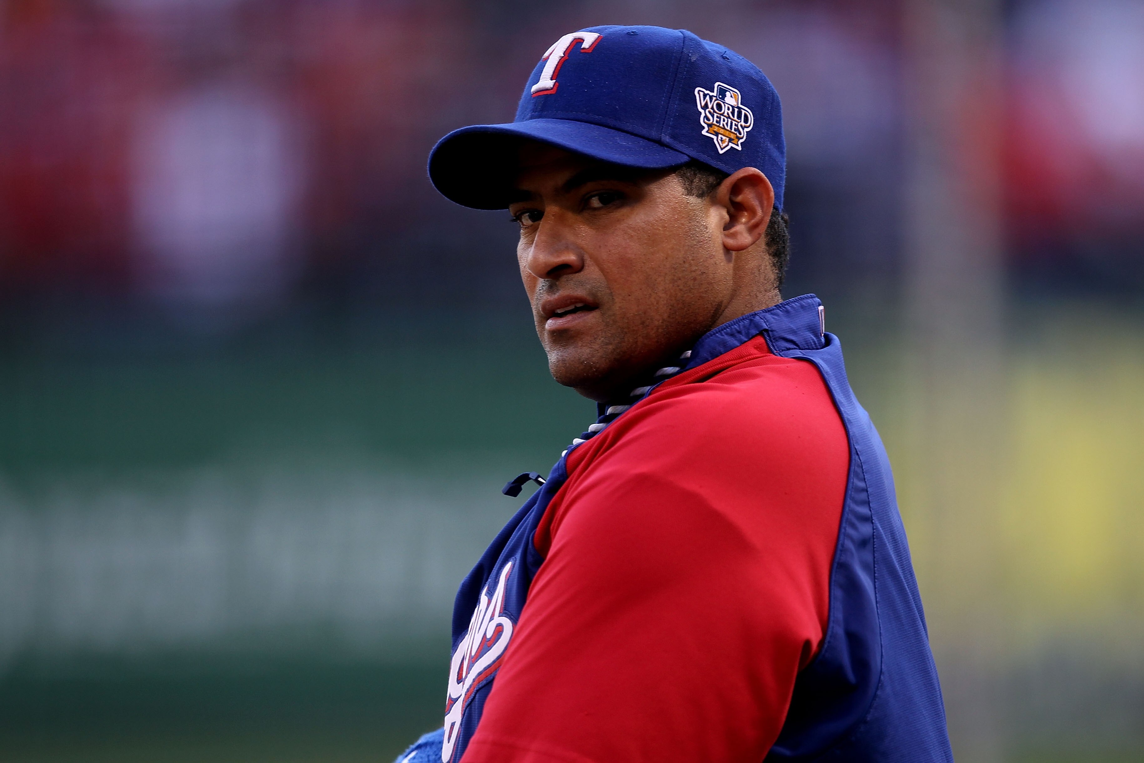 ARLINGTON, TX - OCTOBER 31:  Bengie Molina #11 of the Texas Rangers looks on during batting practice against the San Francisco Giants in Game Four of the 2010 MLB World Series at Rangers Ballpark in Arlington on October 31, 2010 in Arlington, Texas.  (Pho