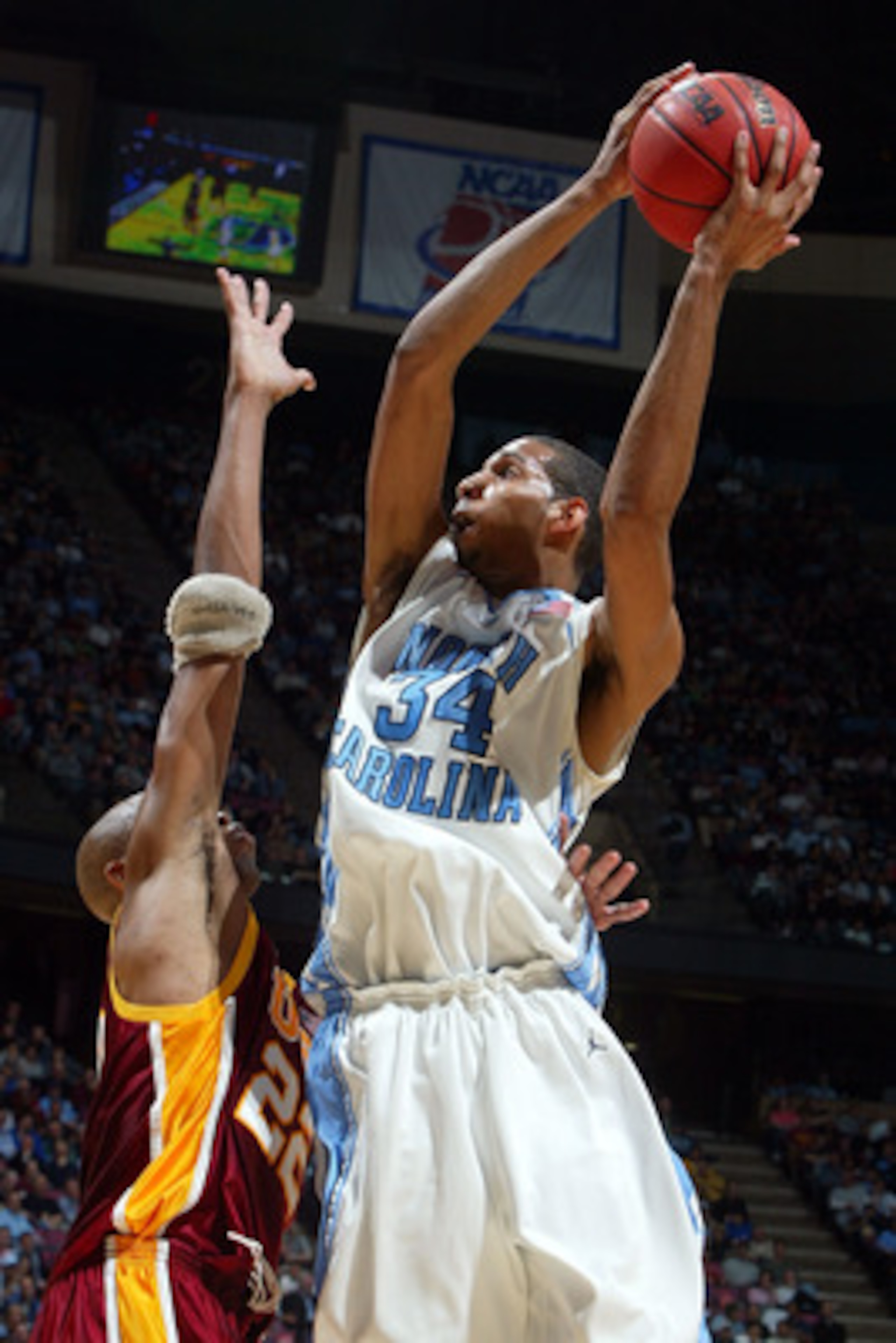 EAST RUTHERFORD, NJ - MARCH 23:  Brandan Wright #34 of the University of North Carolina Tar Heels goes to the hoop against Taj Gibson #22 of the University of Southern California Trojans during the NCAA Men's East Regional Semifinal at Continental Airline