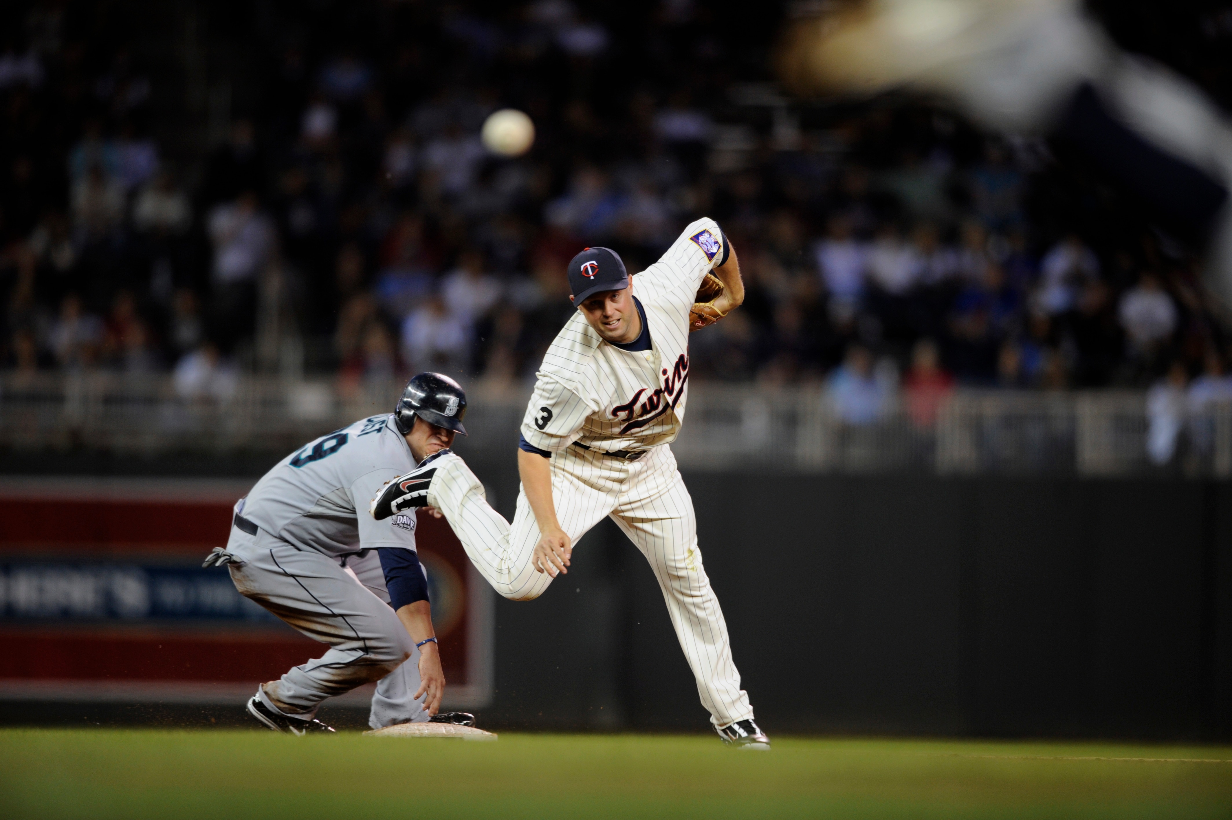 MINNEAPOLIS, MN - MAY 23: Jack Cust #29 of the Seattle Mariners is forced out at second base as second baseman Michael Cuddyer #5 of the Minnesota Twins tries to turn two during their game on May 23, 2011 at Target Field in Minneapolis, Minnesota. The Roc