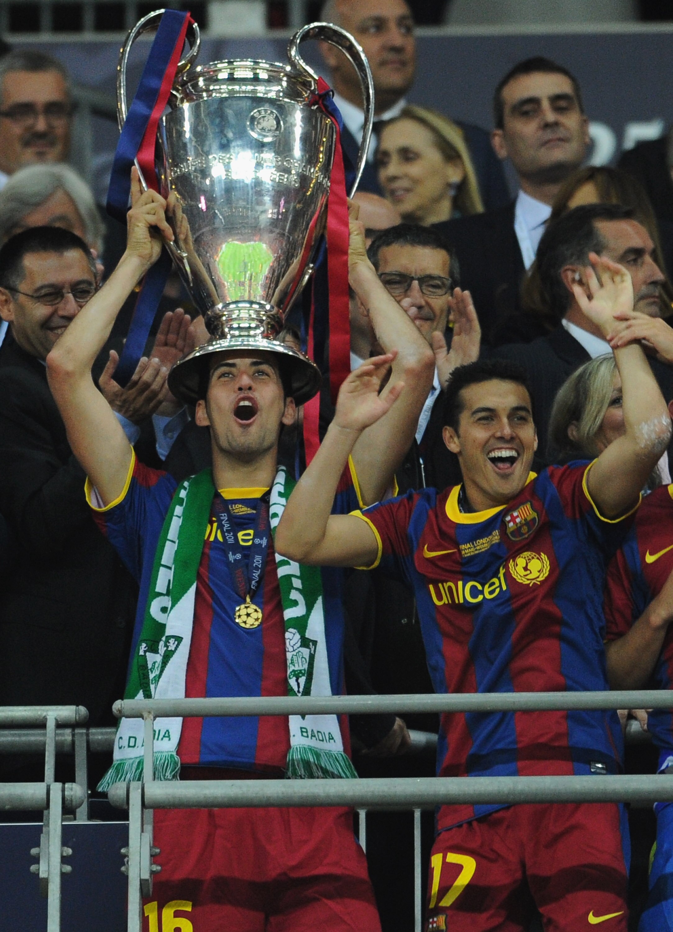LONDON, ENGLAND - MAY 28:  Sergio Busquets of FC Barcelona (L) lifts the trophy alongside Pedro after victory in the UEFA Champions League final between FC Barcelona and Manchester United FC at Wembley Stadium on May 28, 2011 in London, England.  (Photo b