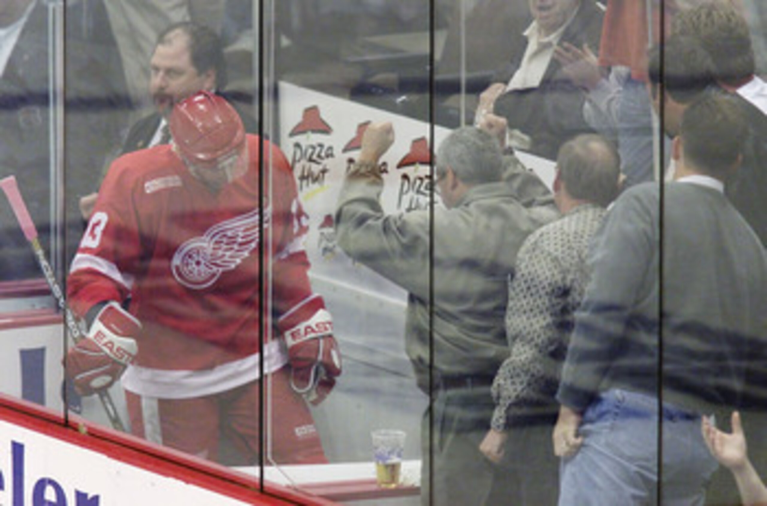 27 Apr 2000:  Colorado Avalanche fans pound on the glass to the penalty box as Vyacheslav Kozlov #13 of the Detroit Red Wings starts a penalty during the first period in Game 1 of the Western Conference Semifinals at the Pepsi Center in Denver, Colorado. 