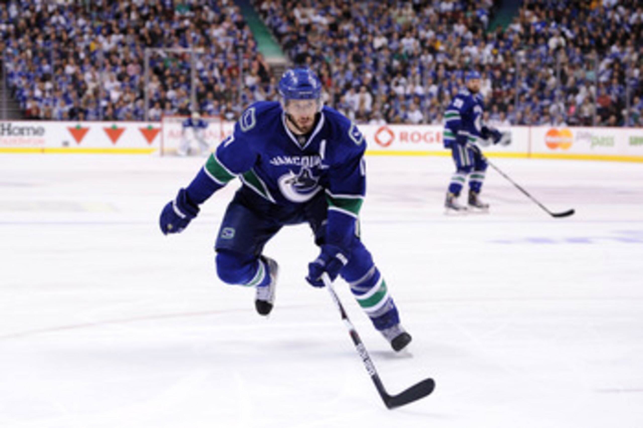 VANCOUVER, CANADA - MAY 15:  Ryan Kesler #17 of the Vancouver Canucks skates in to forecheck the play against the San Jose Sharks in Game One of the Western Conference Finals during the 2011 Stanley Cup Playoffs at Rogers Arena on May 15, 2011 in Vancouve