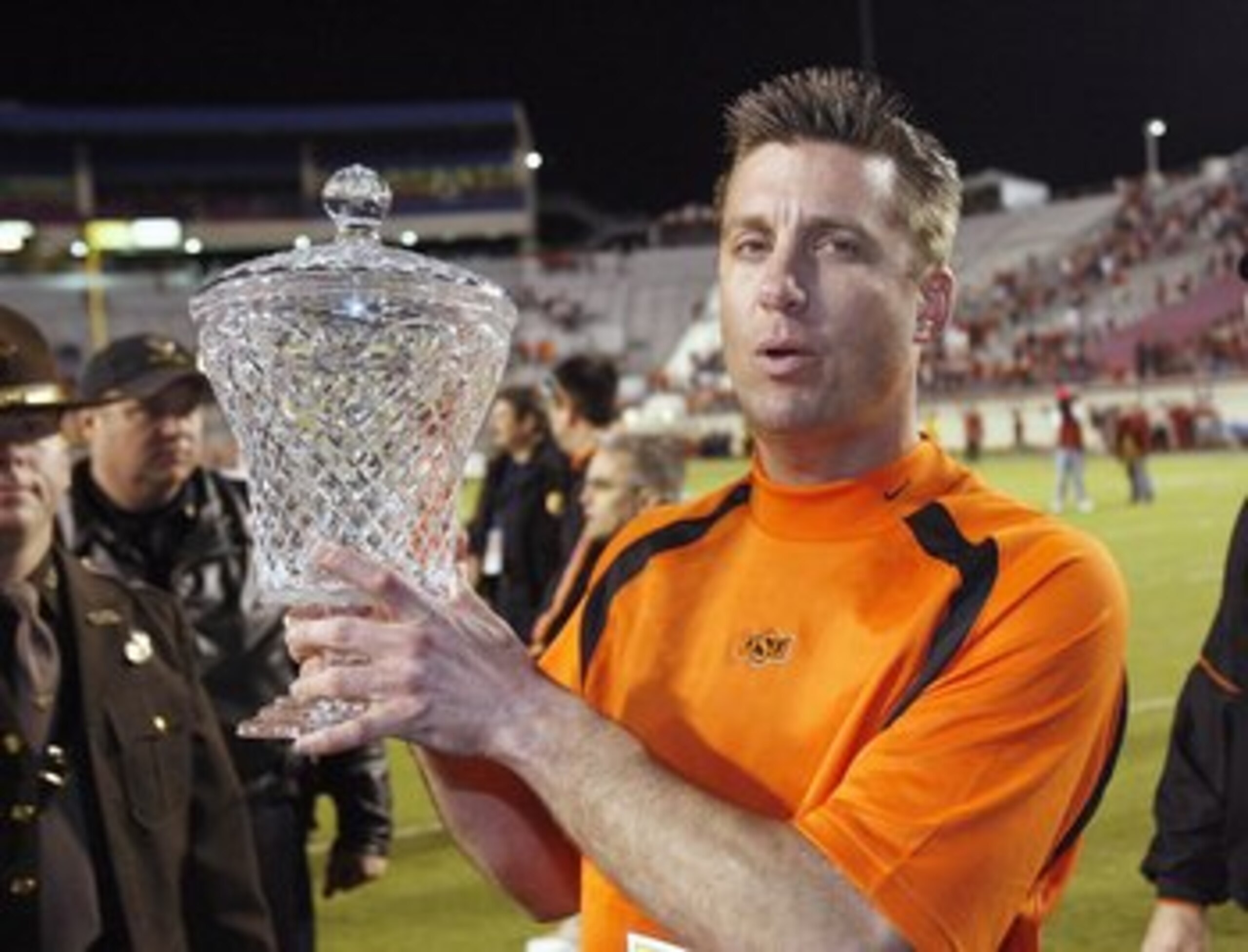 SHREVEPORT, LA - DECEMBER 28: Head coach Mike Gundy of Oklahoma State poses with the PetroSun Independence Bow trophy after the win against Alabama on December 28, 2006 at Independence Stadium in Shreveport, Louisiana. (Photo by Chris Graythen/Getty Image