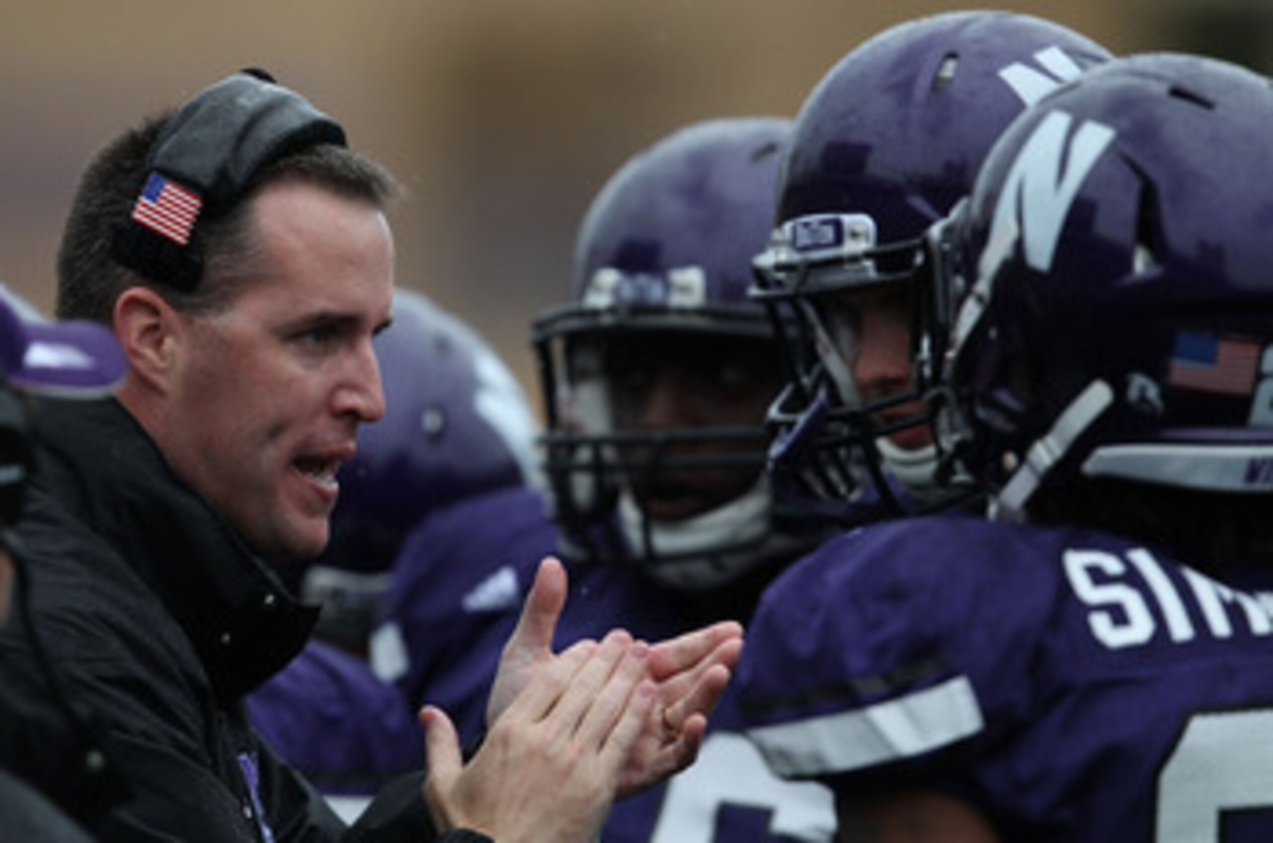 EVANSTON, IL - OCTOBER 23: Head coach Pat Fitzgerald of the Northwestern Wildcats encourages his team as they take on the Michigan State Spartans at Ryan Field on October 23, 2010 in Evanston, Illinois. Michigan State defeated Northwestern 35-27. (Photo b