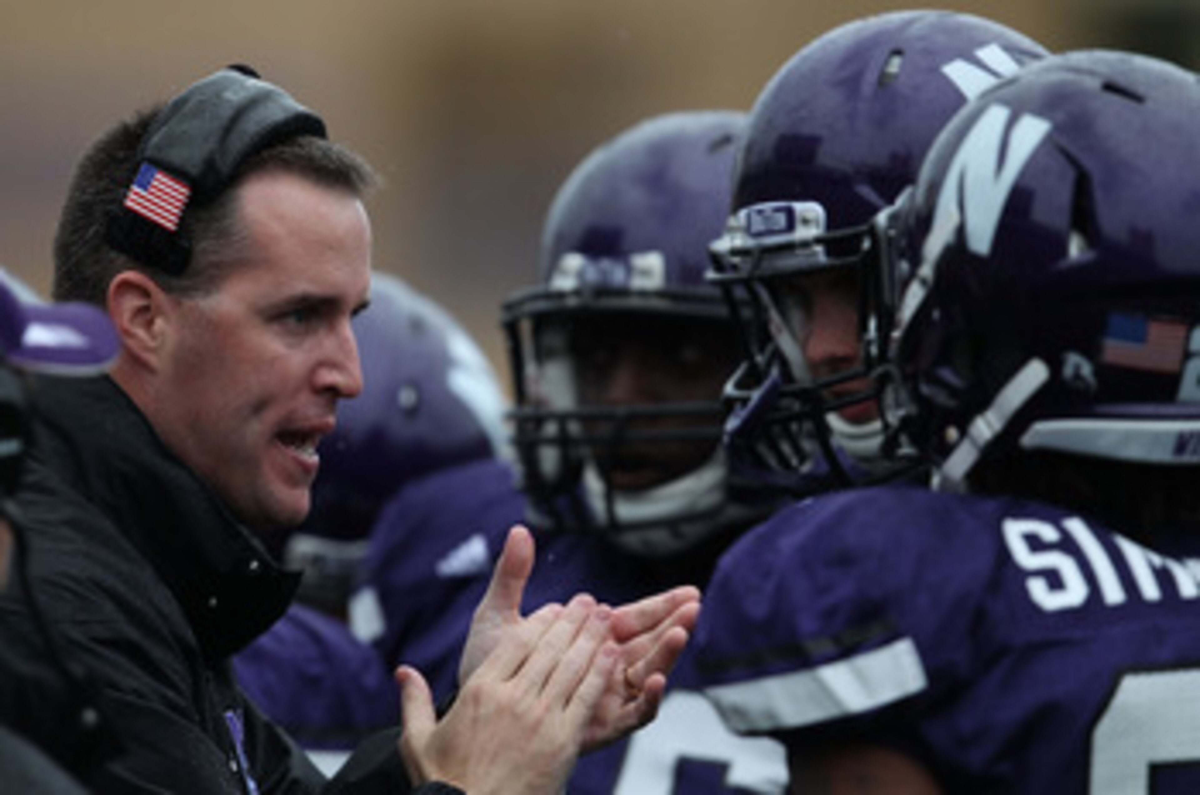 EVANSTON, IL - OCTOBER 23: Head coach Pat Fitzgerald of the Northwestern Wildcats encourages his team as they take on the Michigan State Spartans at Ryan Field on October 23, 2010 in Evanston, Illinois. Michigan State defeated Northwestern 35-27. (Photo b