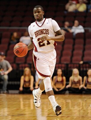 LAS VEGAS, NV - MARCH 05:  Kevin Foster #21 of the Santa Clara Broncos brings the ball up the court against the Loyola Marymount Lions during a quarterfinal game of the Zappos.com West Coast Conference Basketball tournament at the Orleans Arena March 5, 2