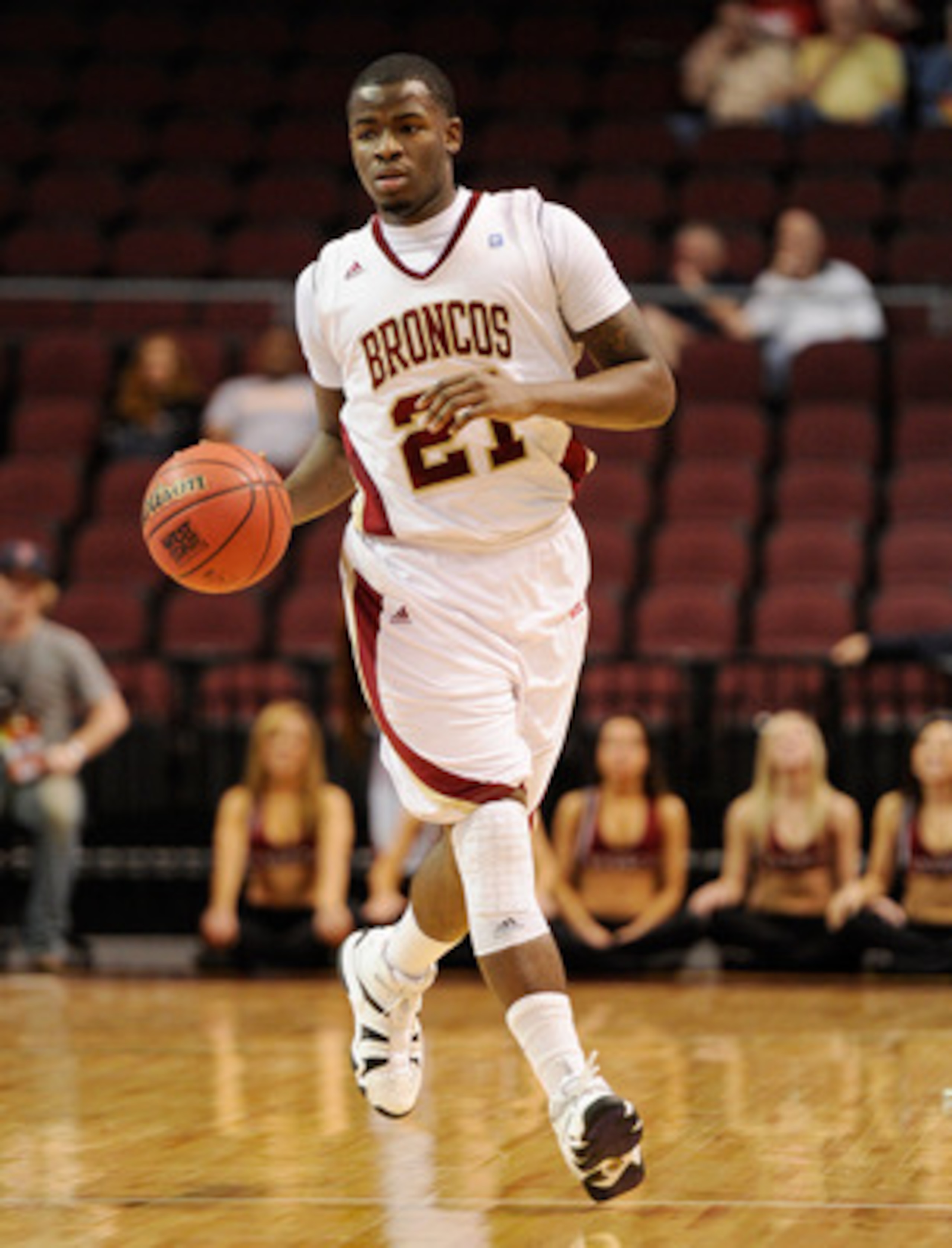 LAS VEGAS, NV - MARCH 05:  Kevin Foster #21 of the Santa Clara Broncos brings the ball up the court against the Loyola Marymount Lions during a quarterfinal game of the Zappos.com West Coast Conference Basketball tournament at the Orleans Arena March 5, 2