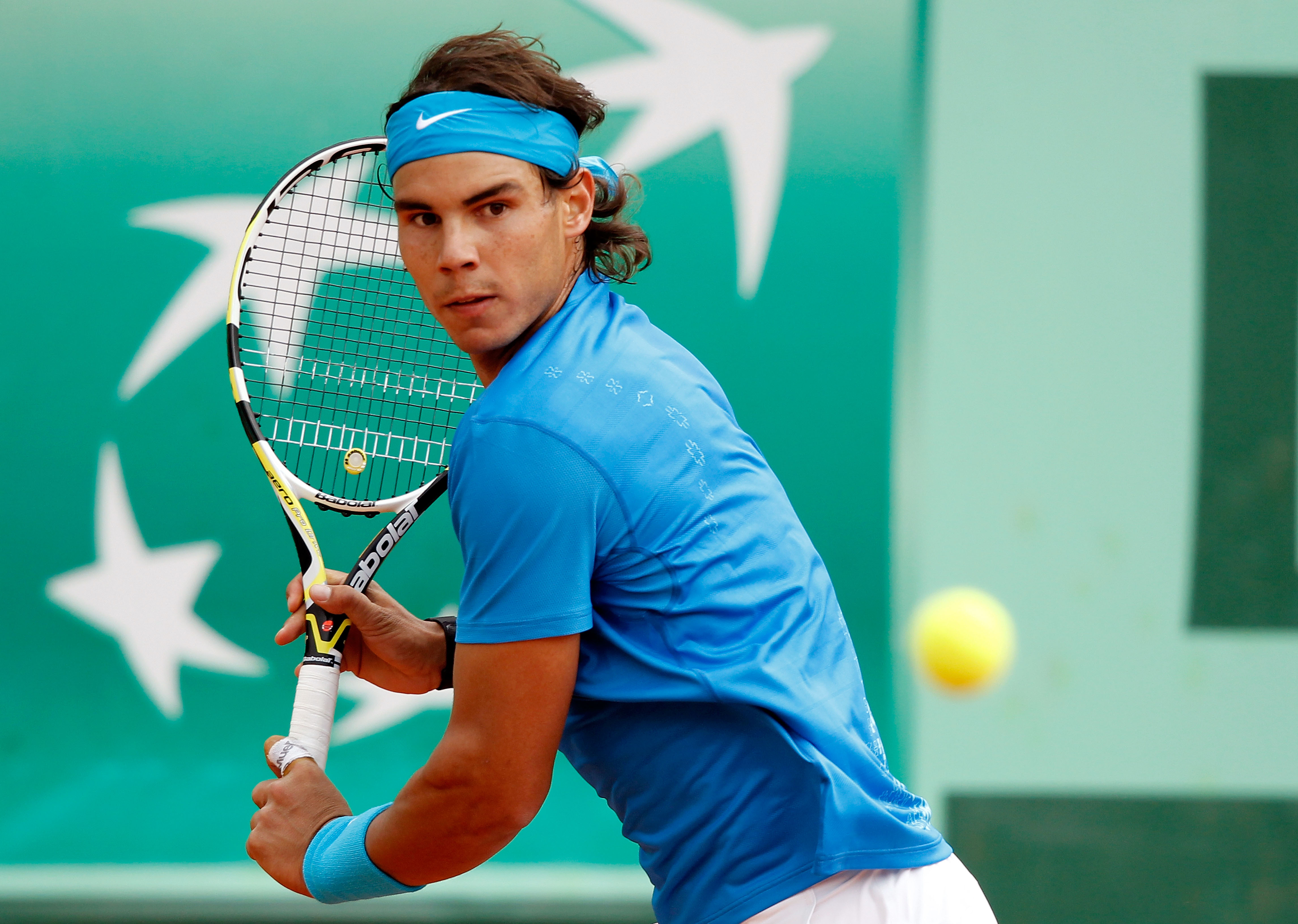 PARIS, FRANCE - MAY 26:  Rafael Nadal of Spain prepares to hit a backhand during the men's singles round two match between Rafael Nadal of Spain and Pablo Andujar of Spain on day five of the French Open at Roland Garros on May 26, 2011 in Paris, France.