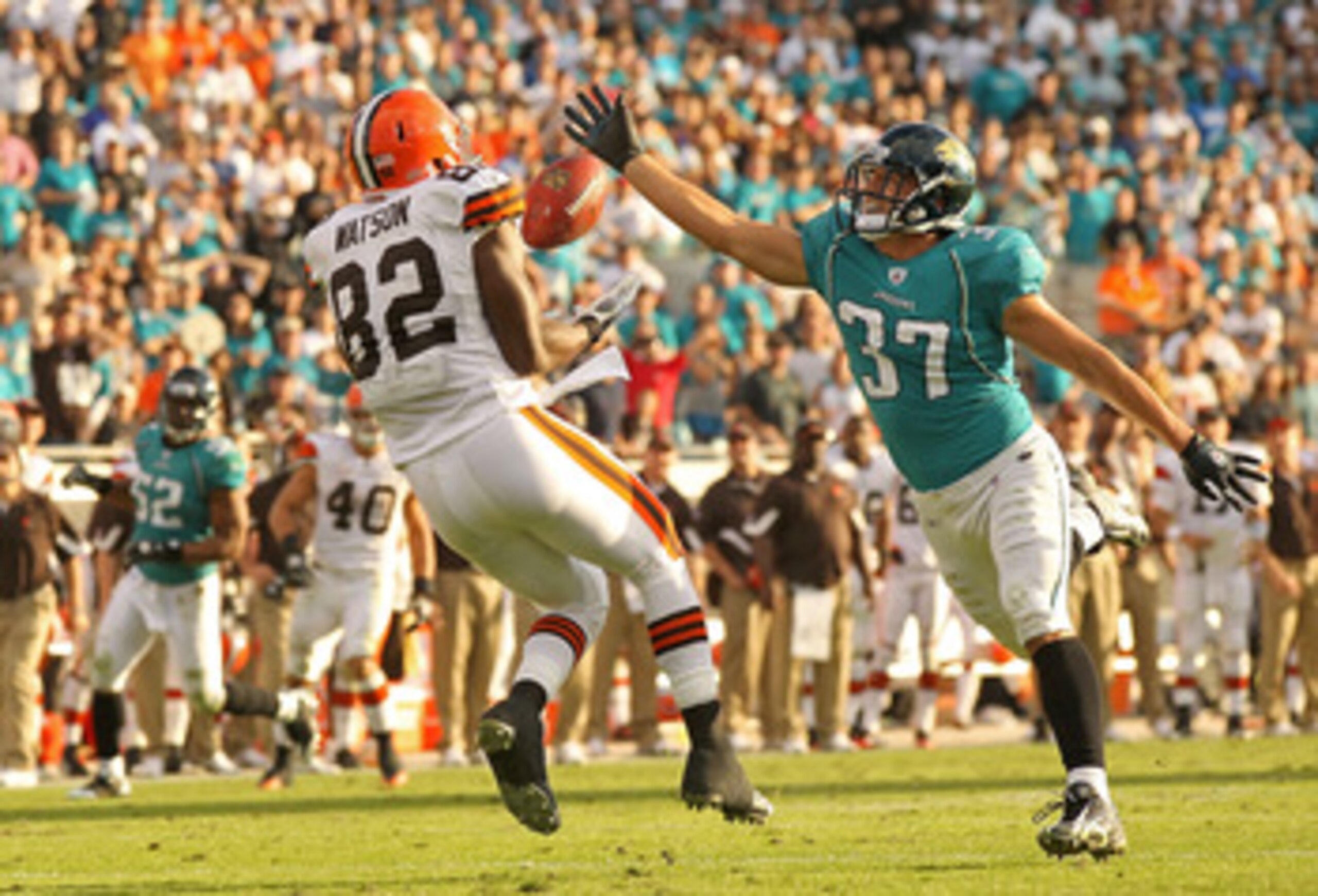 JACKSONVILLE, FL - NOVEMBER 21:  Sean Considine #37 of the Jacksonville Jaguars recovers an interception from Benjamin Watson #82 to end the game   agaisnt the Cleveland Browns at EverBank Field on November 21, 2010 in Jacksonville, Florida.  (Photo by Mi