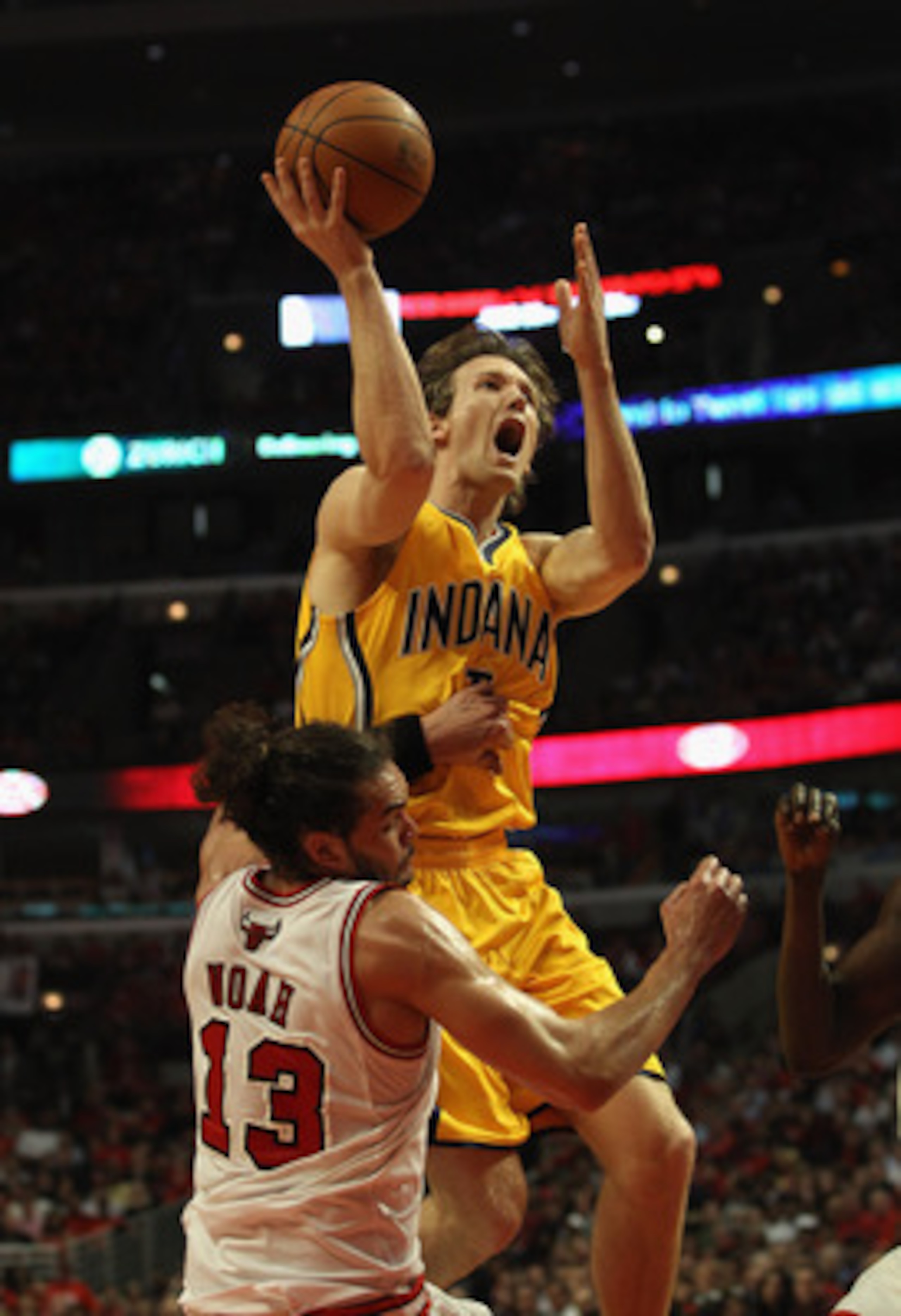 CHICAGO, IL - APRIL 26: Joakim Noah #13 of the Chicago Bulls fouls Mike Dunleavy #17 of the Indiana Pacers as he shoots in Game Five of the Eastern Conference Quarterfinals in the 2011 NBA Playoffs at the United Center on April 26, 2011 in Chicago, Illino