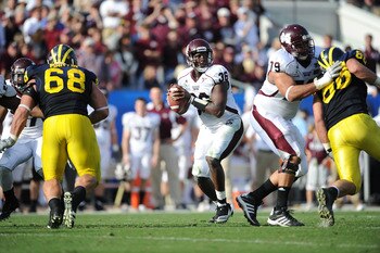 JACKSONVILLE, FL - JANUARY 01:  Quarterback Chris Relf #36 of the Mississippi State Bulldogs passes against the Michigan Wolverines during the Gator Bowl at EverBank Field on January 1, 2011 in Jacksonville, Florida  (Photo by Rick Dole/Getty Images)