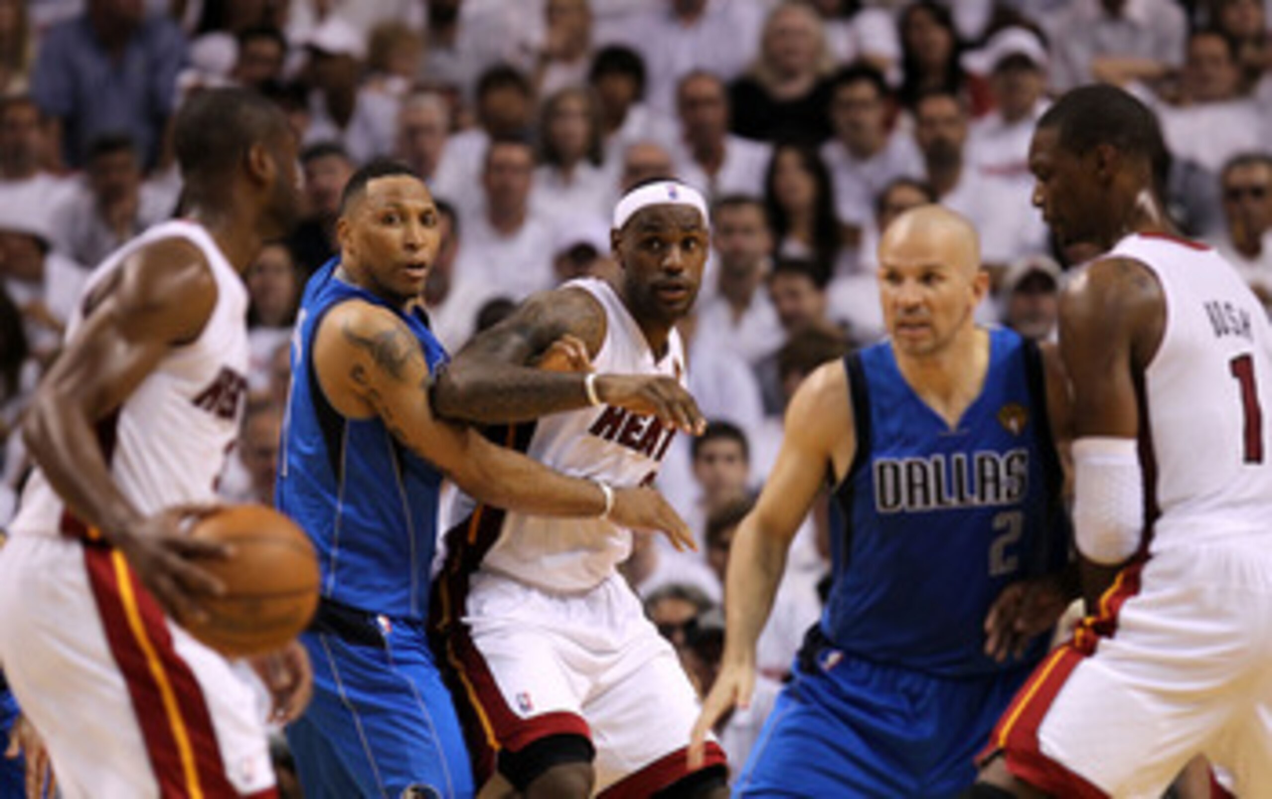 MIAMI, FL - MAY 31:  Dwyane Wade #3 of the Miami Heat looks to pass the ball to LeBron James as CHris Bosh #1 (R) sets a screen against Jason Kidd #2 of the Dallas Mavericks as Shawn Marion (2nd L) #0 of the Mavericks defends James in Game One of the 2011