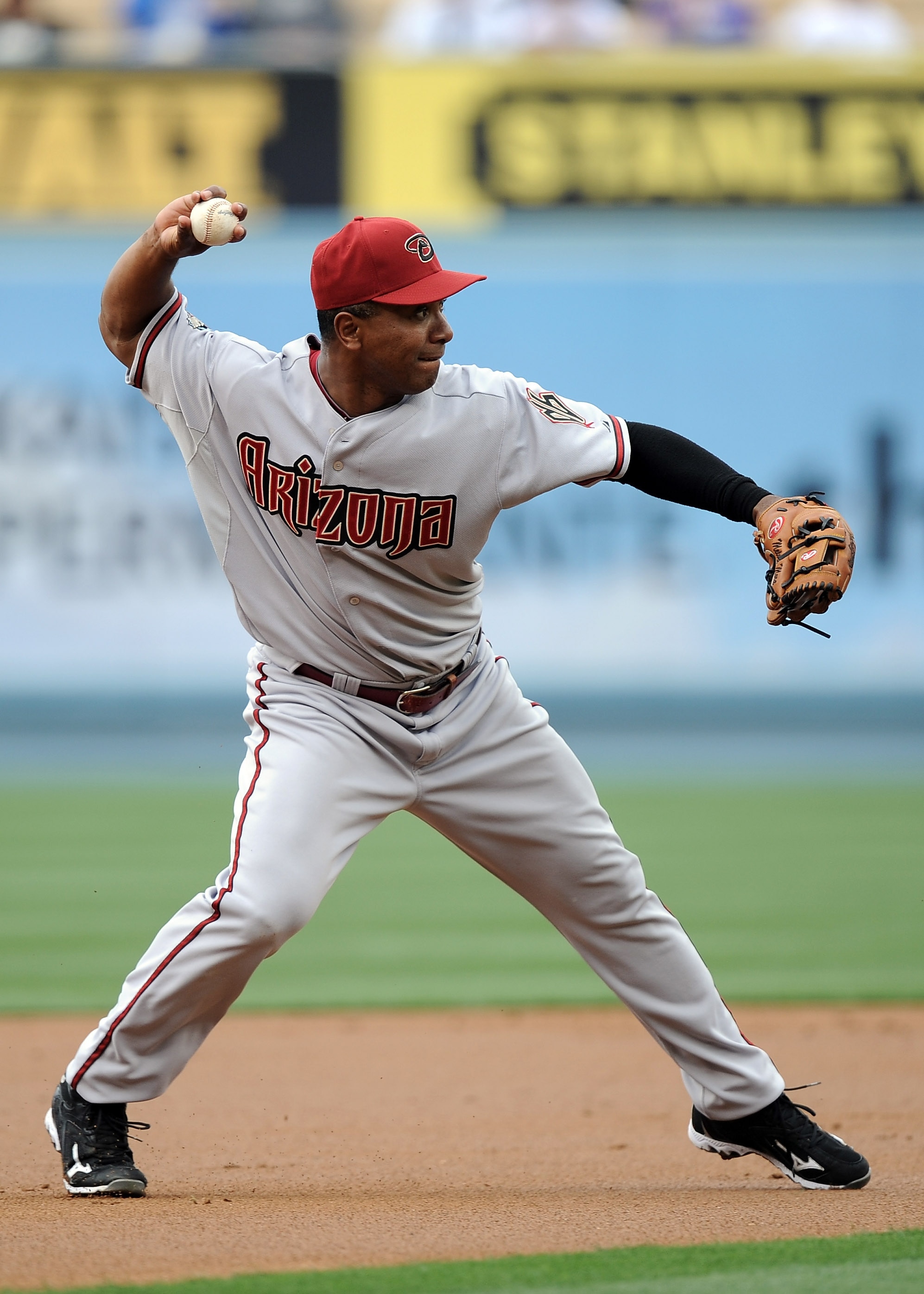 LOS ANGELES, CA - MAY 14:  Melvin Mora #4 of the Arizona Diamondbacks makes a thorw to first base for an out against the Los Angeles Dodgers at Dodger Stadium on May 14, 2011 in Los Angeles, California.  (Photo by Harry How/Getty Images)