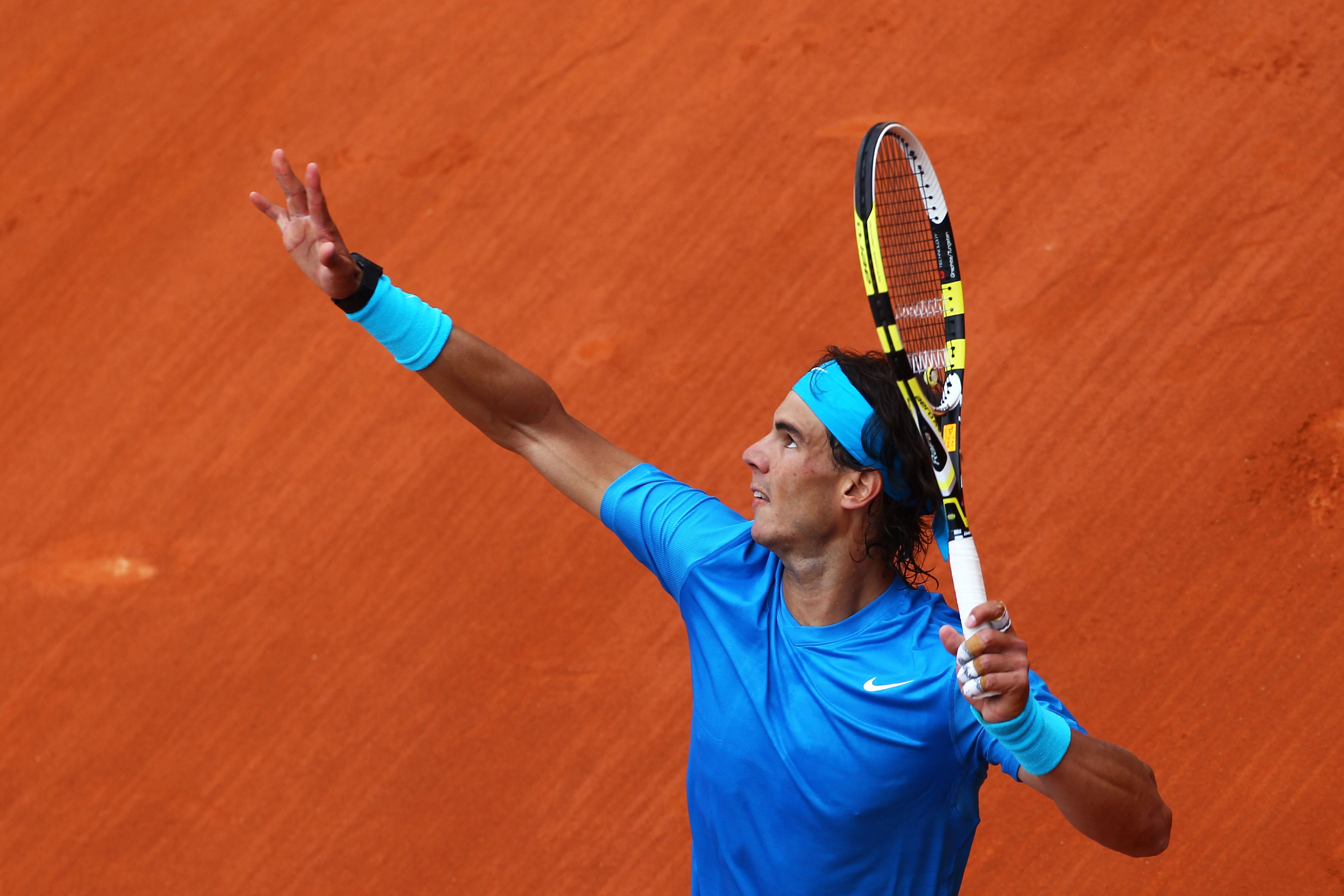 PARIS, FRANCE - MAY 30:  Rafael Nadal of Spain serves during the men's singles round four match between Rafael Nadal of Spain and Ivan Lubicic of Croatia on day nine of the French Open at Roland Garros on May 30, 2011 in Paris, France.  (Photo by Clive Br