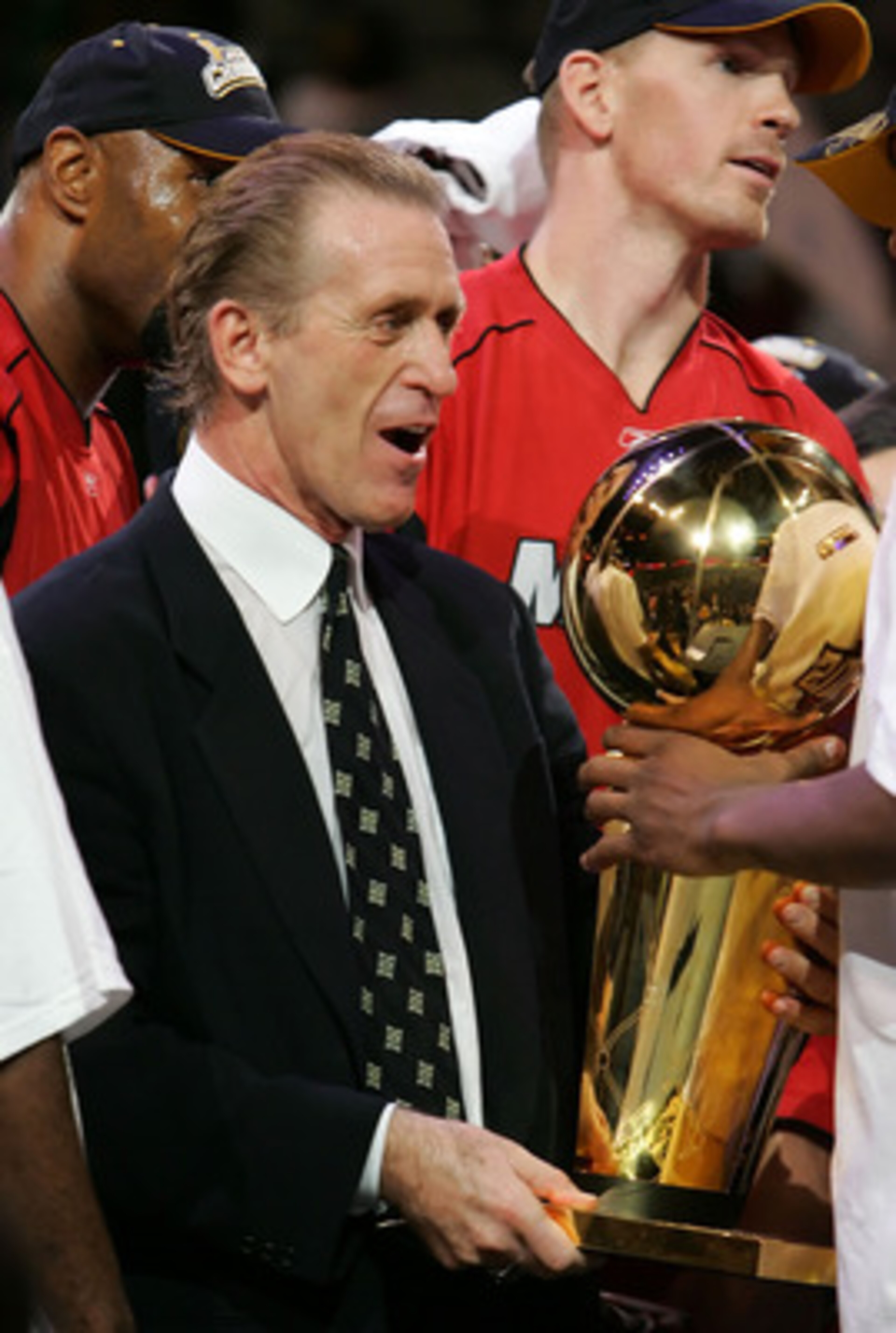 DALLAS - JUNE 20: Head coach Pat Riley of the Miami Heat is handed the trophy after game six of the 2006 NBA Finals on June 20, 2006 at American Airlines Center in Dallas, Texas. The Heat defeated the Mavericks 95-92 to win the NBA title. NOTE TO USER: DALLAS - JUNE 20: Head coach Pat Riley of the Miami Heat is handed the trophy after game six of the 2006 NBA Finals on June 20, 2006 at American Airlines Center in Dallas, Texas. The Heat defeated the Mavericks 95-92 to win the NBA title. NOTE TO USER: