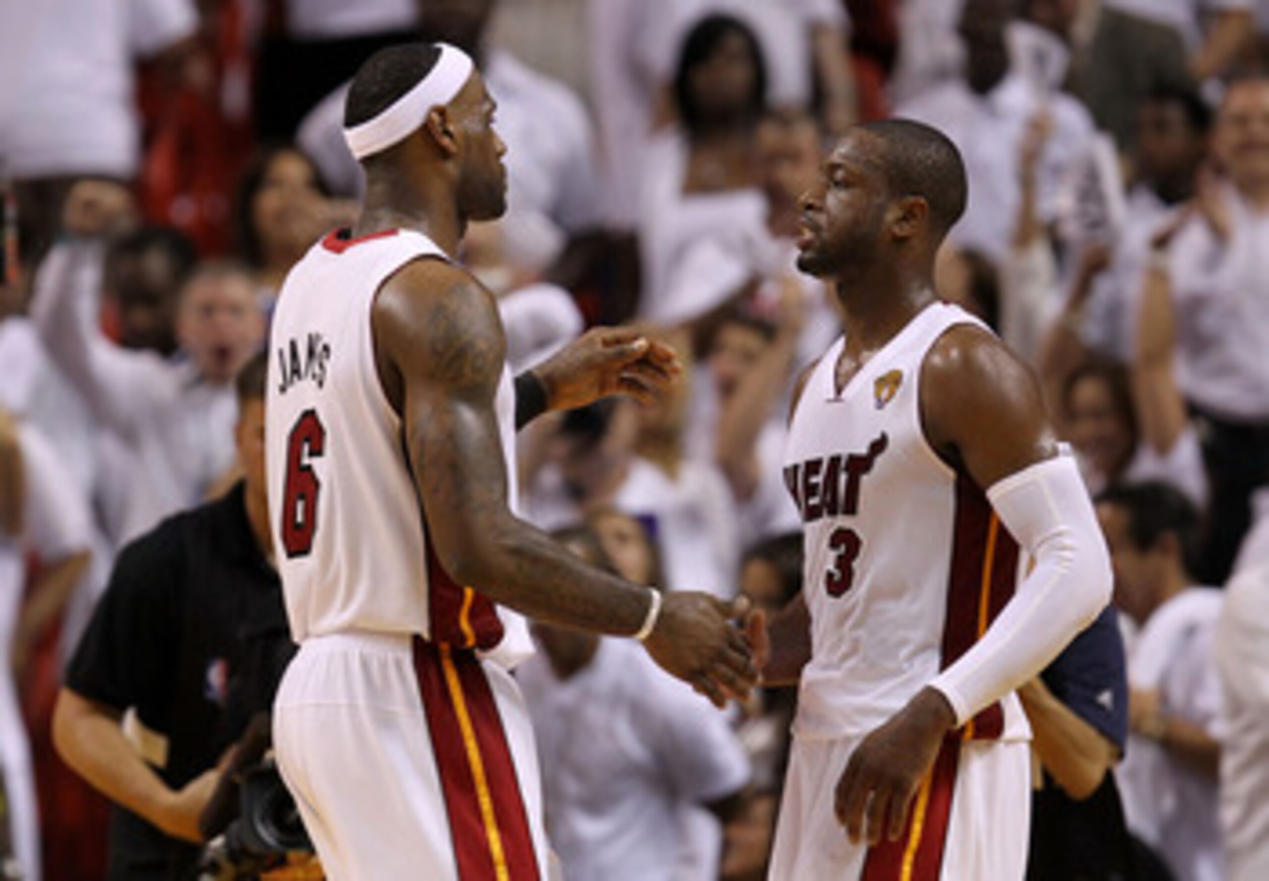 MIAMI, FL - MAY 31:  LeBron James #6 and Dwyane Wade #3 of the Miami Heat react in the fourth quarter before the Heat defeat the Dallas Mavericks 92-84 in Game One of the 2011 NBA Finals at American Airlines Arena on May 31, 2011 in Miami, Florida. NOTE T