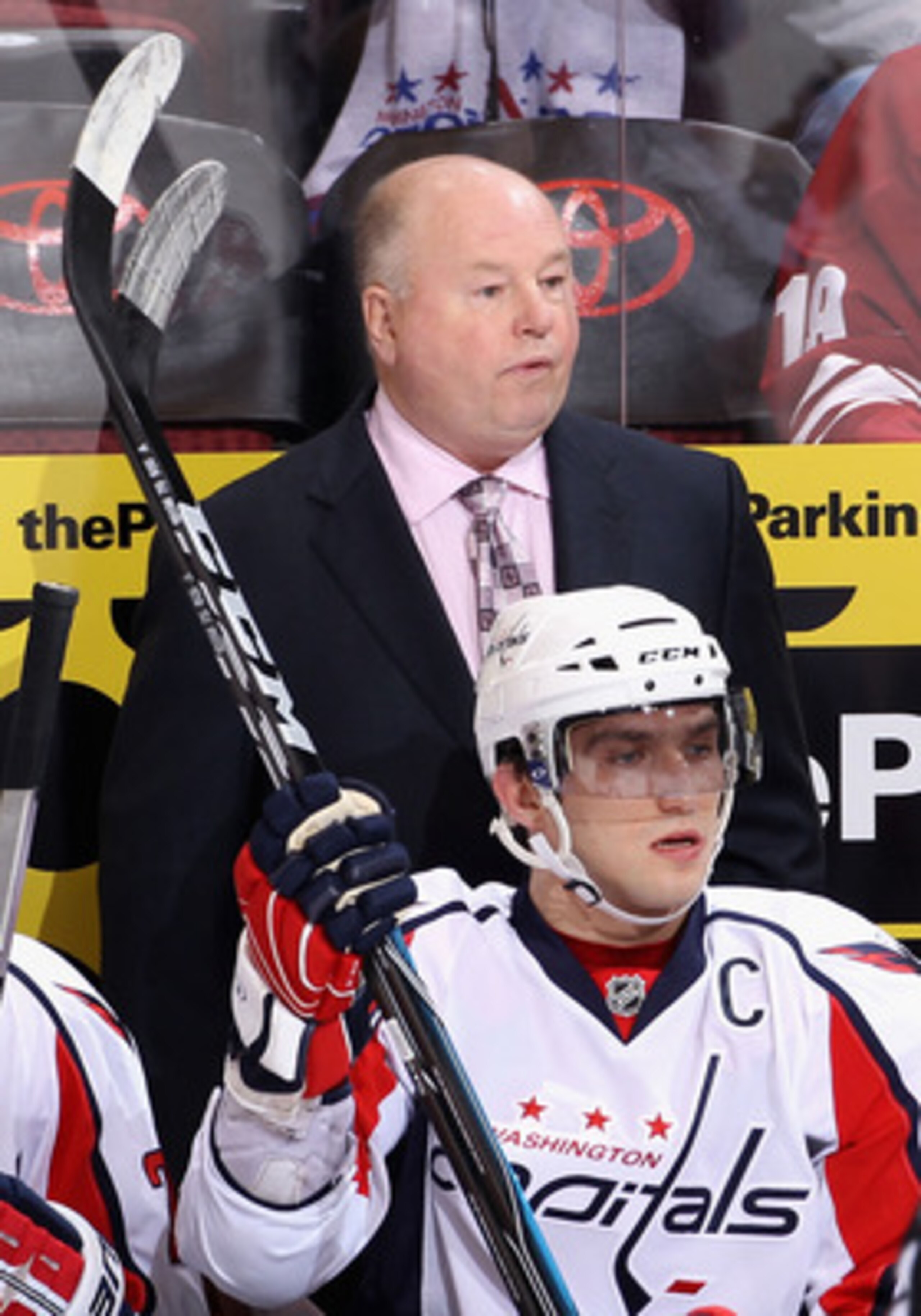 GLENDALE, AZ - FEBRUARY 14: Head coach Bruce Boudreau and Alex Ovechkin #8 of the Washington Capitals watch from the bench during the NHL game against the Phoenix Coyotes at Jobing.com Arena on February 14, 2011 in Glendale, Arizona. The Coyotes defeated GLENDALE, AZ - FEBRUARY 14: Head coach Bruce Boudreau and Alex Ovechkin #8 of the Washington Capitals watch from the bench during the NHL game against the Phoenix Coyotes at Jobing.com Arena on February 14, 2011 in Glendale, Arizona. The Coyotes defeated