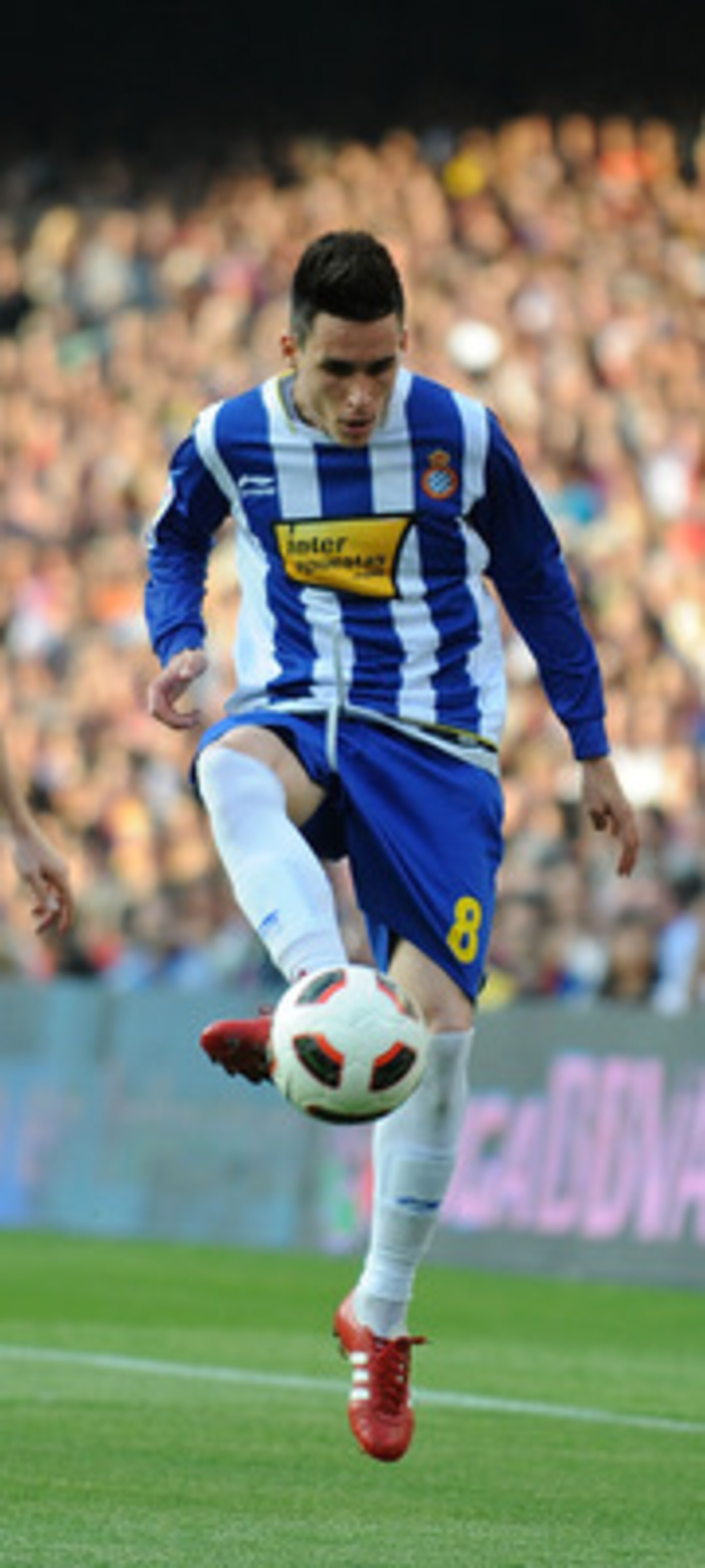 BARCELONA, SPAIN - MAY 08: Jose Callejon (R) of Espanyol passes the ball beside Andreu Fontas of Barcelona during the La Liga match between Barcelona and Espanyol at Nou Camp on May 8, 2011 in Barcelona, Spain.  (Photo by Denis Doyle/Getty Images)