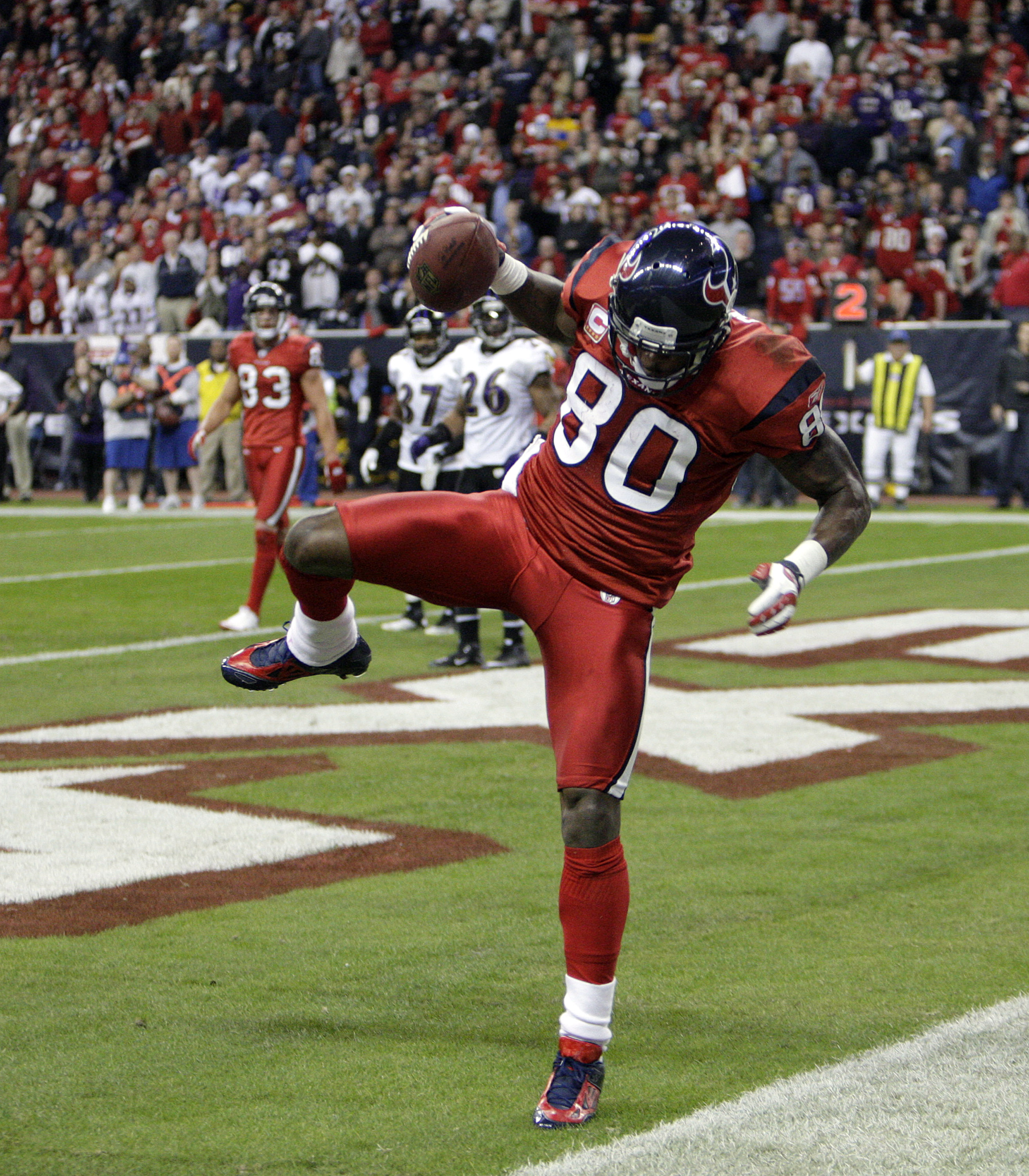 HOUSTON, TX - DECEMBER 13:  Wide receiver Andre Johnson #80 of the Houston Texans comes scores as he get's his foot down in the endzone in the fourth quarter against the Baltimore Ravens at Reliant Stadium on December 13, 2010 in Houston, Texas. Baltimore