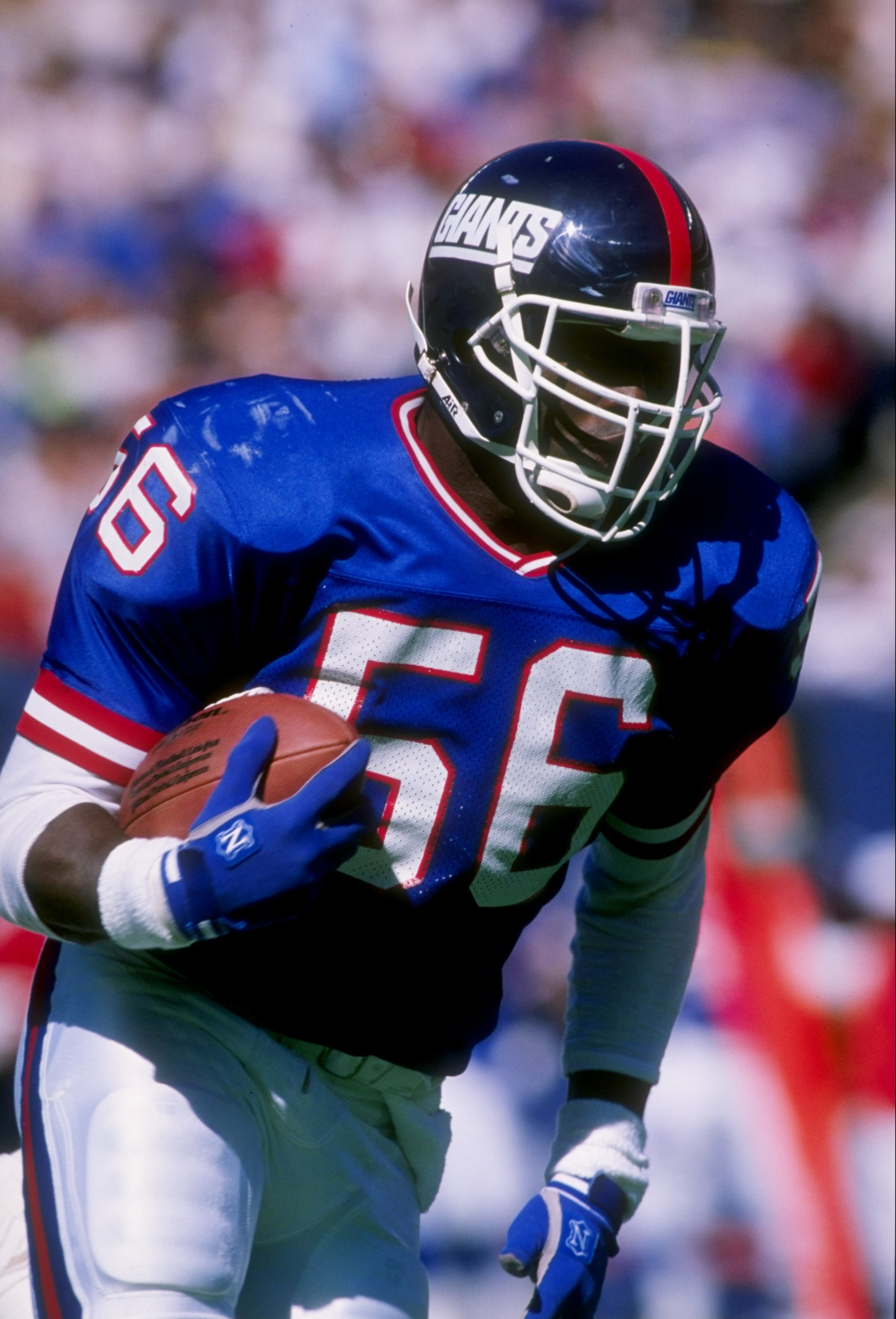 24 Sep 1989: Linebacker Lawrence Taylor of the New York Giants holds the ball during a game against the Phoenix Cardinals at Giants Stadium in the Meadowlands in East Rutherford, New Jersey. The Giants won the game 35-7.