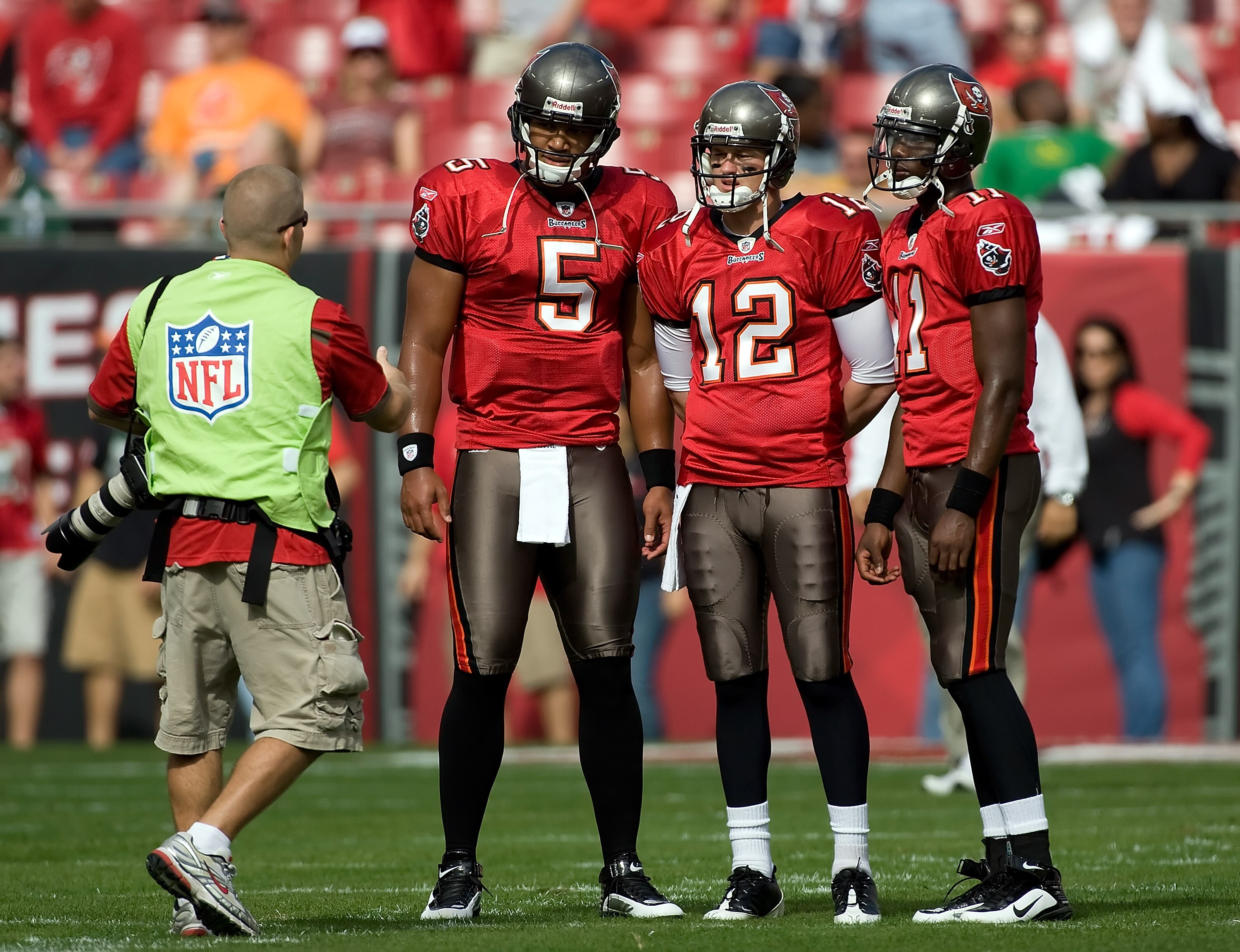 TAMPA, FL - DECEMBER 13:  Quarterbacks Josh Freeman #5, Rudy Carpenter #12 and Josh Johnson #11 of the Tampa Bay Buccaneers pose for a photo just prior to the start of the game against the New York Jets at Raymond James Stadium on December 13, 2009 in Tam