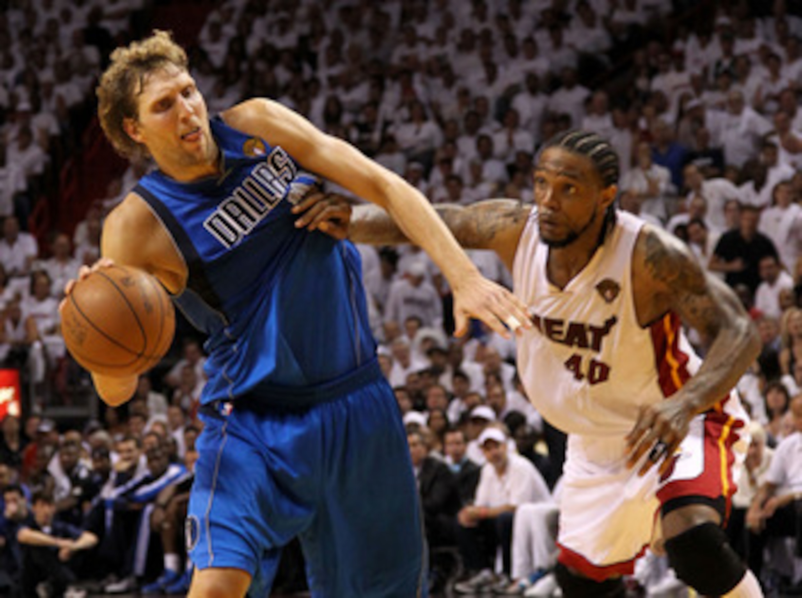 MIAMI, FL - MAY 31: Dirk Nowitzki #41 of the Dallas Mavericks drives on Udonis Haslem #40 of the Miami Heat in the fourth quarter in Game One of the 2011 NBA Finals at American Airlines Arena on May 31, 2011 in Miami, Florida. NOTE TO USER: User expressl MIAMI, FL - MAY 31: Dirk Nowitzki #41 of the Dallas Mavericks drives on Udonis Haslem #40 of the Miami Heat in the fourth quarter in Game One of the 2011 NBA Finals at American Airlines Arena on May 31, 2011 in Miami, Florida. NOTE TO USER: User expressl