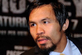 LAS VEGAS, NV - MAY 07:  Manny Pacquiao (R) throws a right at Shane Mosley in the sixth round of their WBO welterweight title fight at the MGM Grand Garden Arena May 7, 2011 in Las Vegas, Nevada. Pacquiao retained his title with a unanimous-decision victo