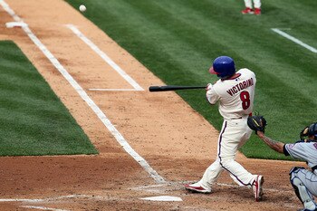 PHILADELPHIA - MAY 01:  Shane Victorino #8 of the Philadelphia Phillies connects on a fourth inning three run home run against the New York Mets at Citizens Bank Park on May 1, 2010 in Philadelphia, Pennsylvania.  (Photo by Jim McIsaac/Getty Images)