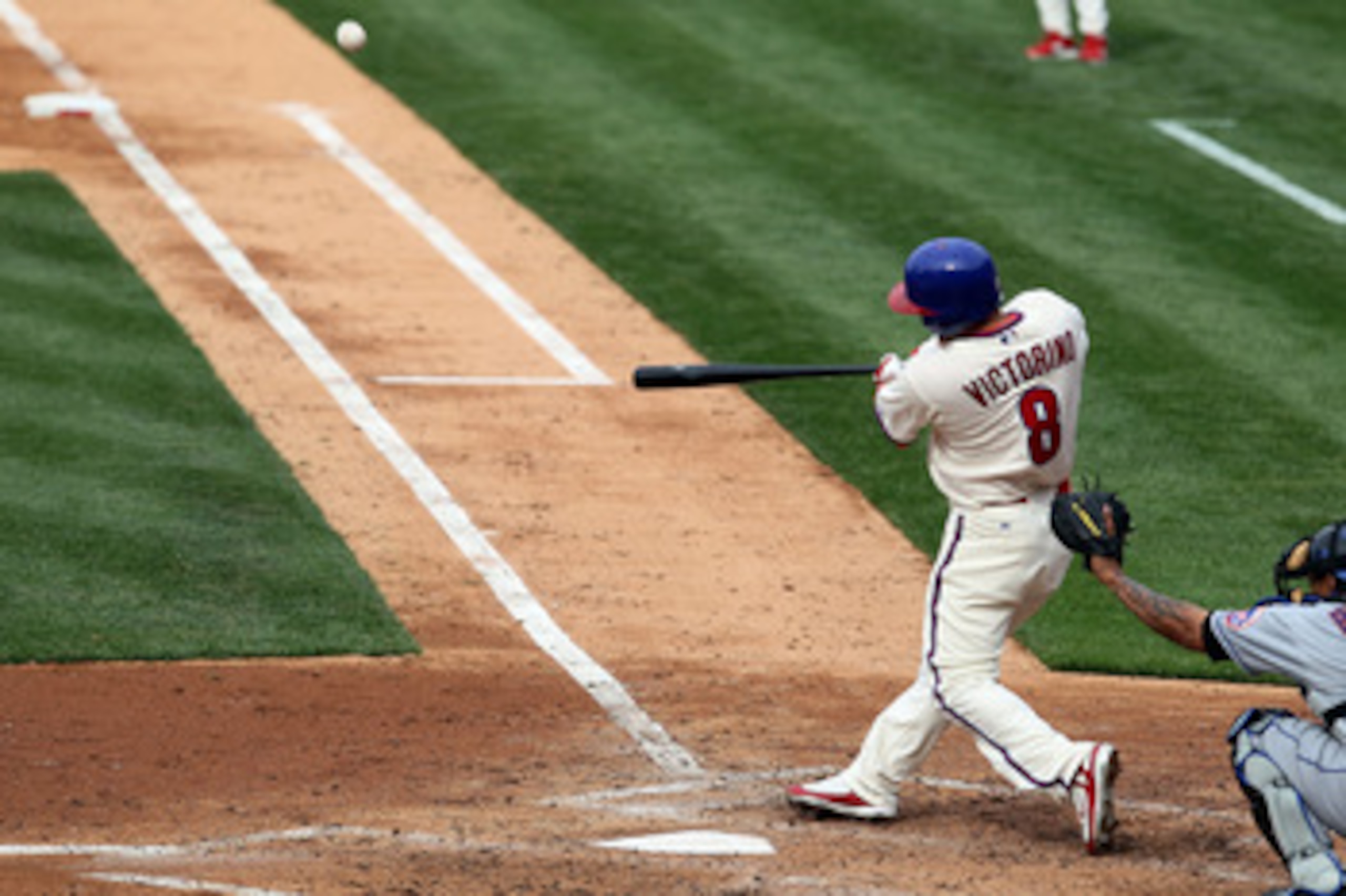 PHILADELPHIA - MAY 01:  Shane Victorino #8 of the Philadelphia Phillies connects on a fourth inning three run home run against the New York Mets at Citizens Bank Park on May 1, 2010 in Philadelphia, Pennsylvania.  (Photo by Jim McIsaac/Getty Images)