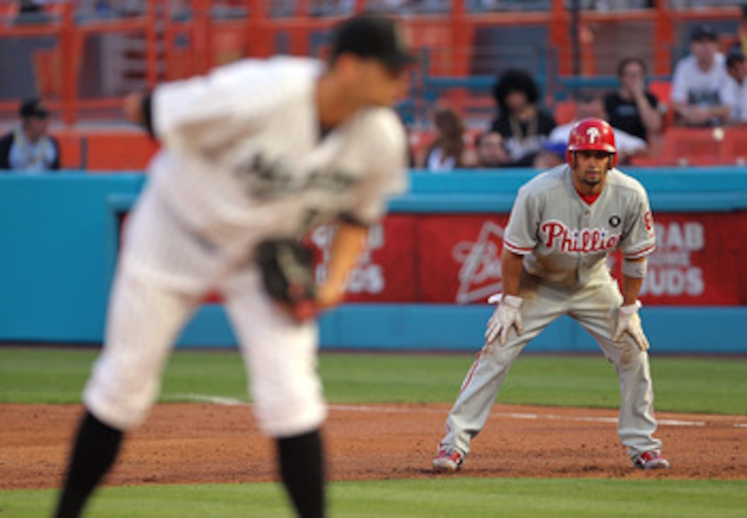 MIAMI GARDENS, FL - MAY 10:  Shane Victorino #8 of the Philadelphia Phillies leads off against Josh Johnson #55 of the Florida Marlins during a game at Sun Life Stadium on May 10, 2011 in Miami Gardens, Florida.  (Photo by Mike Ehrmann/Getty Images)