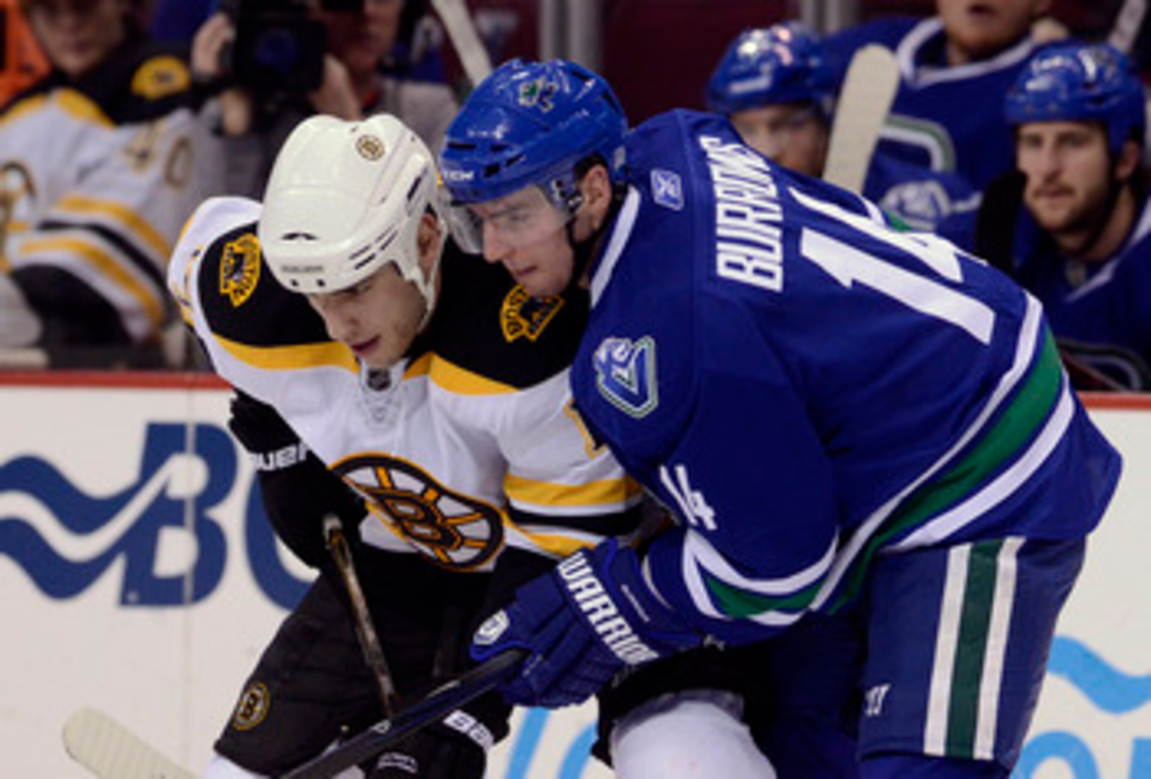 VANCOUVER, CANADA - FEBRUARY 26: Alexandre Burrows #14 of the Vancouver Canucks gets in close to Milan Lucic #17 of the Boston Bruins on a face-off during the third period in NHL action on February 26, 2011 at Rogers Arena in Vancouver, British Columbia, VANCOUVER, CANADA - FEBRUARY 26: Alexandre Burrows #14 of the Vancouver Canucks gets in close to Milan Lucic #17 of the Boston Bruins on a face-off during the third period in NHL action on February 26, 2011 at Rogers Arena in Vancouver, British Columbia,