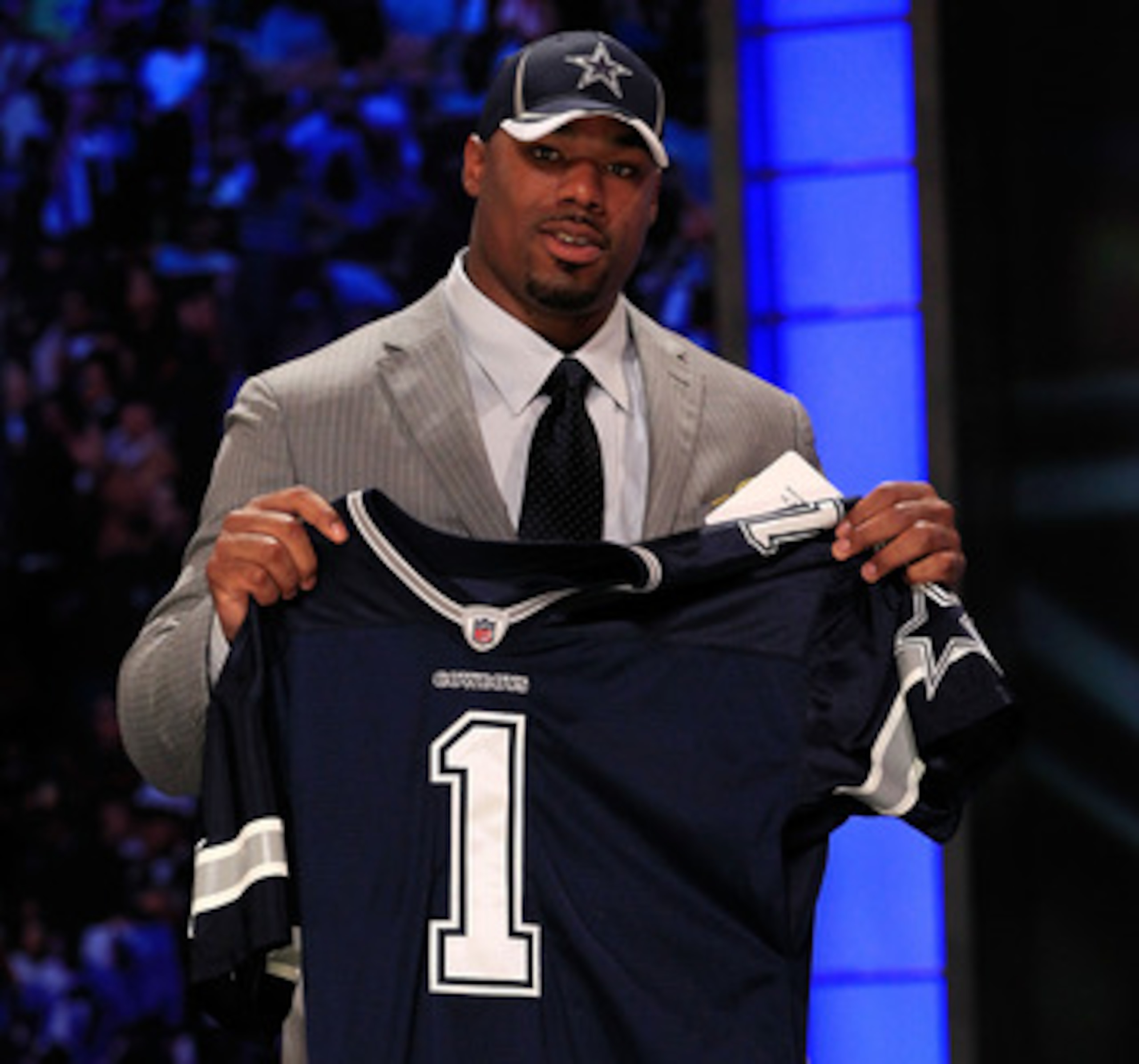 NEW YORK, NY - APRIL 28:  Tyron Smith, #9 overall pick by the Dallas Cowboys, holds up a jersey on stage during the 2011 NFL Draft at Radio City Music Hall on April 28, 2011 in New York City.  (Photo by Chris Trotman/Getty Images)
