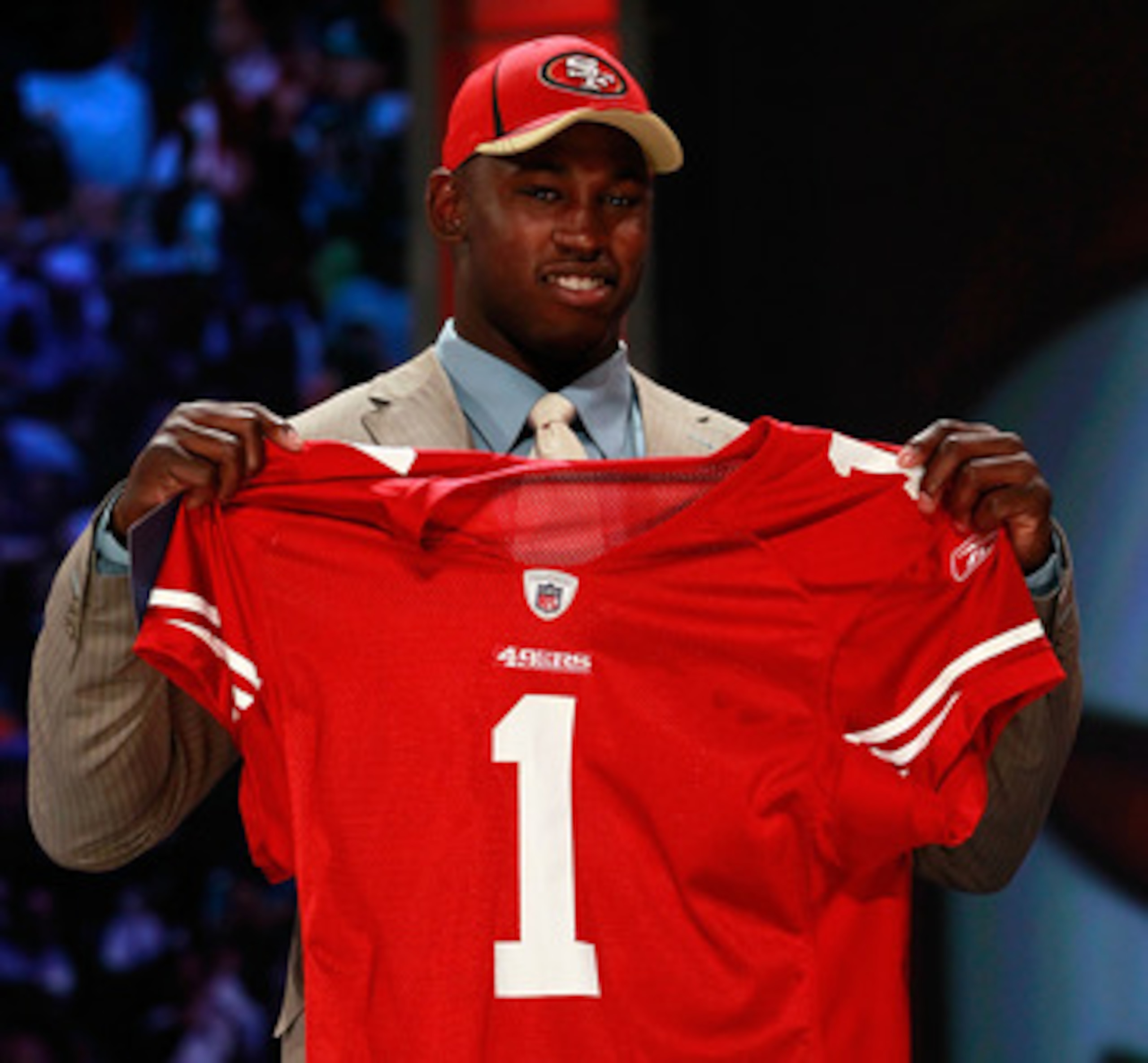NEW YORK, NY - APRIL 28:  Aldon Smith, #7 overall pick by the San Francisco 49ers, holds up a jersey on stage during the 2011 NFL Draft at Radio City Music Hall on April 28, 2011 in New York City.  (Photo by Chris Trotman/Getty Images)