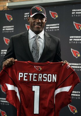 TEMPE, AZ - APRIL 29: First round draft pick Patrick Peterson of the Arizona Cardinals poses with a team jersey during a press conference to introduce him at the team's training center auditorium on April 29, 2011 in Tempe, Arizona. (Photo by Christian TEMPE, AZ - APRIL 29: First round draft pick Patrick Peterson of the Arizona Cardinals poses with a team jersey during a press conference to introduce him at the team's training center auditorium on April 29, 2011 in Tempe, Arizona. (Photo by Christian