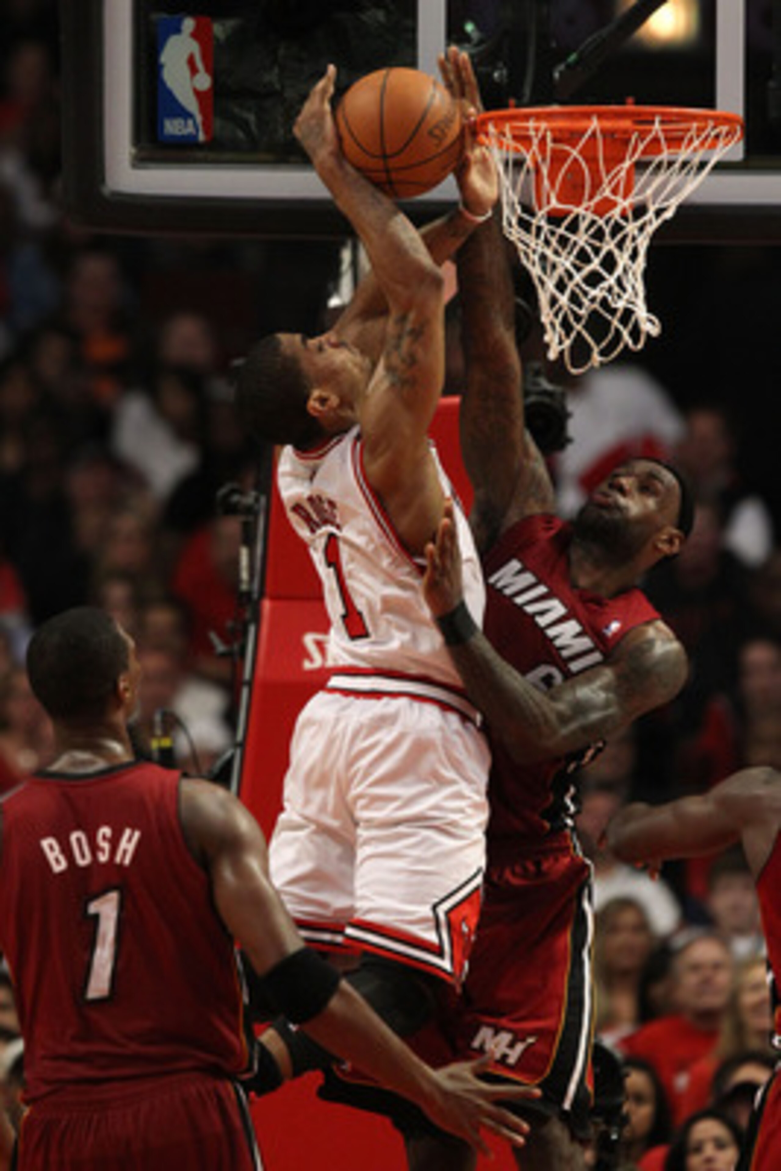 CHICAGO, IL - MAY 18:  Derrick Rose #1 of the Chicago Bulls can't convert on a shot attempt as he drives against LeBron James #6 of the Miami Heat in Game Two of the Eastern Conference Finals during the 2011 NBA Playoffs on May 18, 2011 at the United Cent