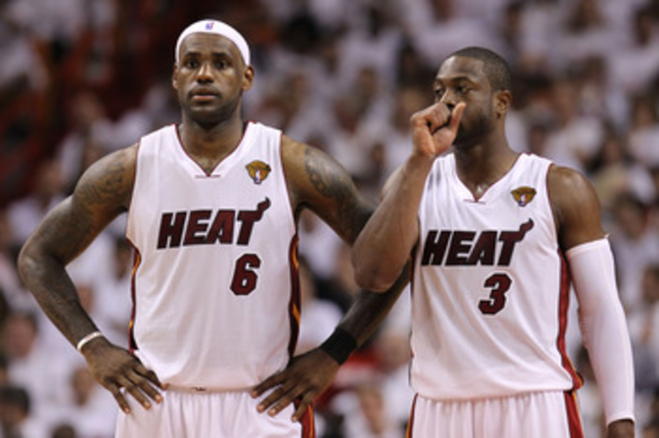 MIAMI, FL - MAY 31:  LeBron James #6 and Dwyane Wade #3 of the Miami Heat react in the fourth quarter before the Heat defeat the Dallas Mavericks 92-84 in Game One of the 2011 NBA Finals at American Airlines Arena on May 31, 2011 in Miami, Florida. NOTE T
