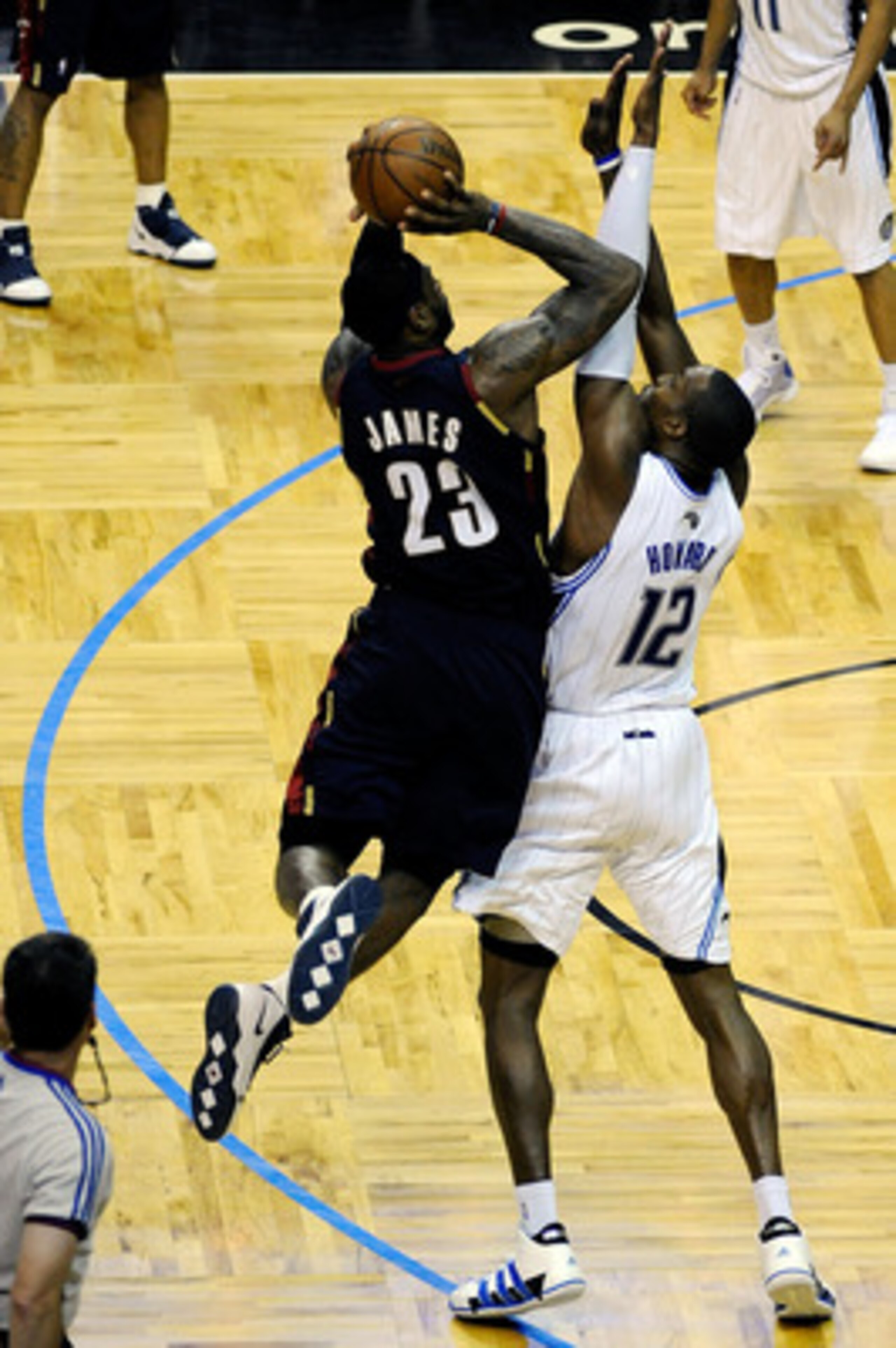 ORLANDO, FL - MAY 26:  LeBron James #23 of the Cleveland Cavaliers shoots against Dwight Howard #12 of the Orlando Magic in overtime of Game Four of the Eastern Conference Finals during the 2009 NBA Playoffs at the Amway Arena on May 26, 2009 in Orlando, 