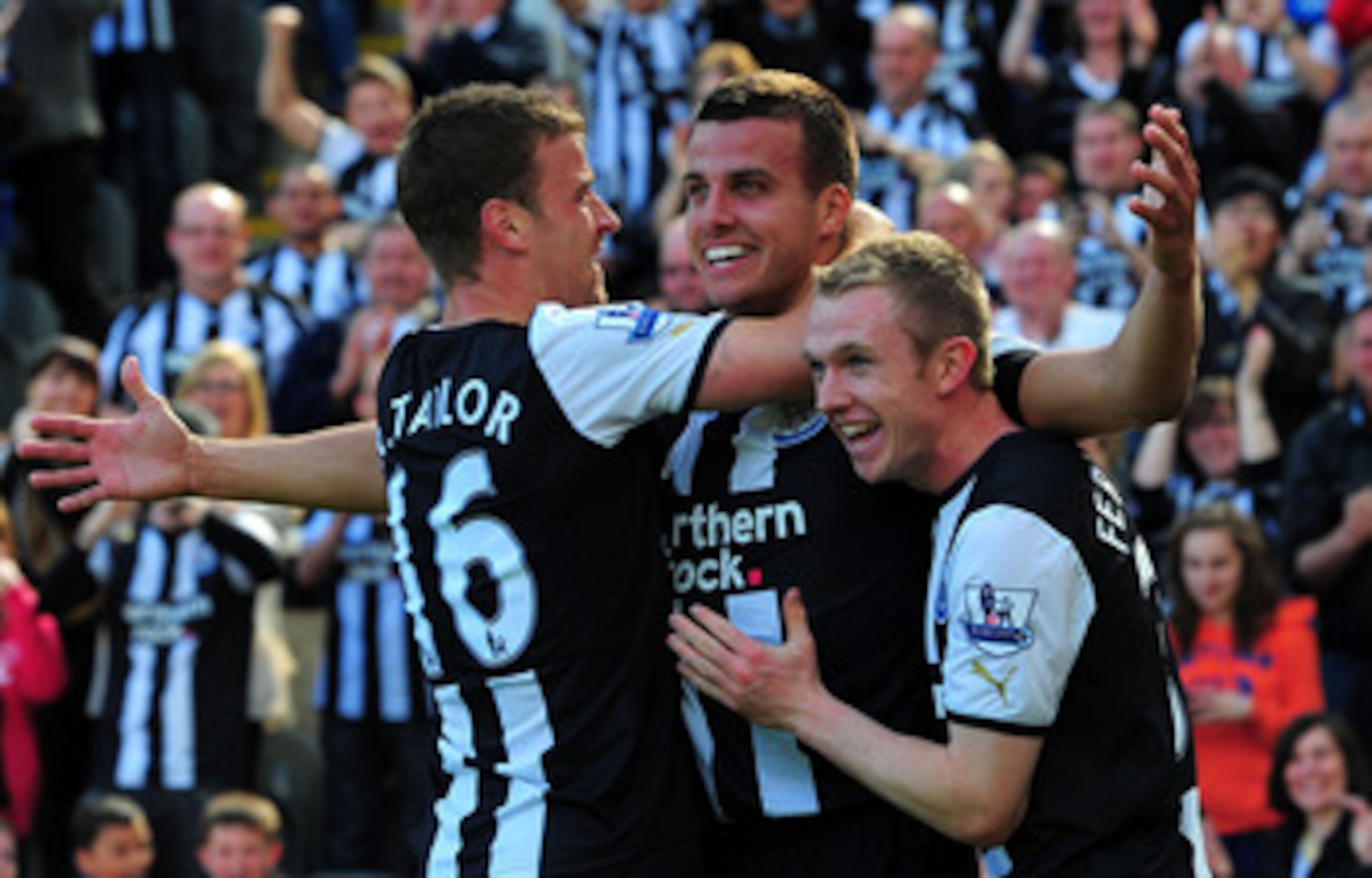 NEWCASTLE UPON TYNE, ENGLAND - MAY 22: Newcastle player Steven Taylor (c) celebrates his goal with Ryan Taylor (l) and Shane Ferguson during the Barclays Premier League game between Newcastle United and West Bromwich Albion at St James' Park on May 22, 20