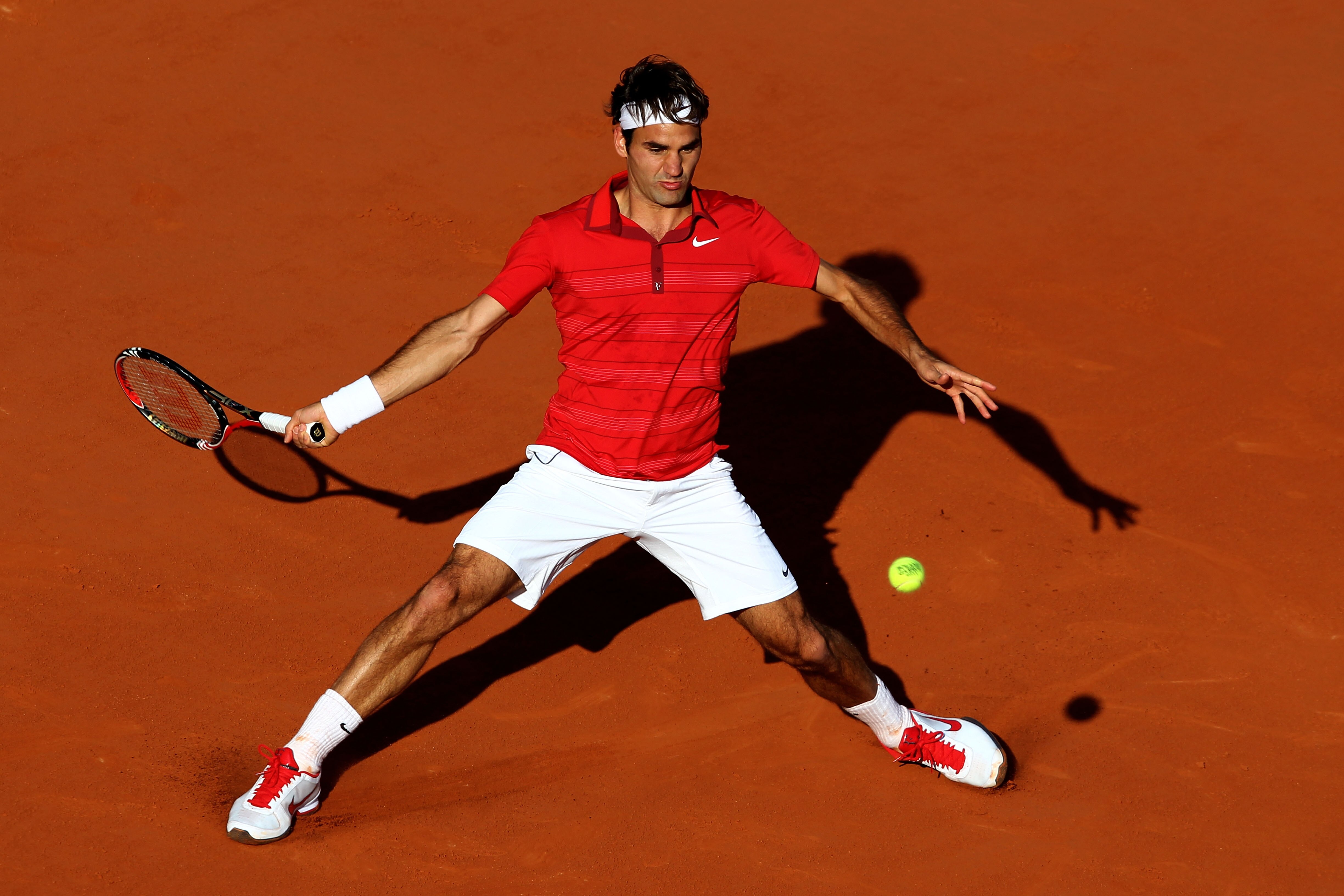 PARIS, FRANCE - MAY 31:  Roger Federer of Switzerland hits a forehand during the men's singles quarterfinal match between Gael Monfils of France and Roger Federer of Switzerland on day ten of the French Open at Roland Garros on May 31, 2011 in Paris, Fran