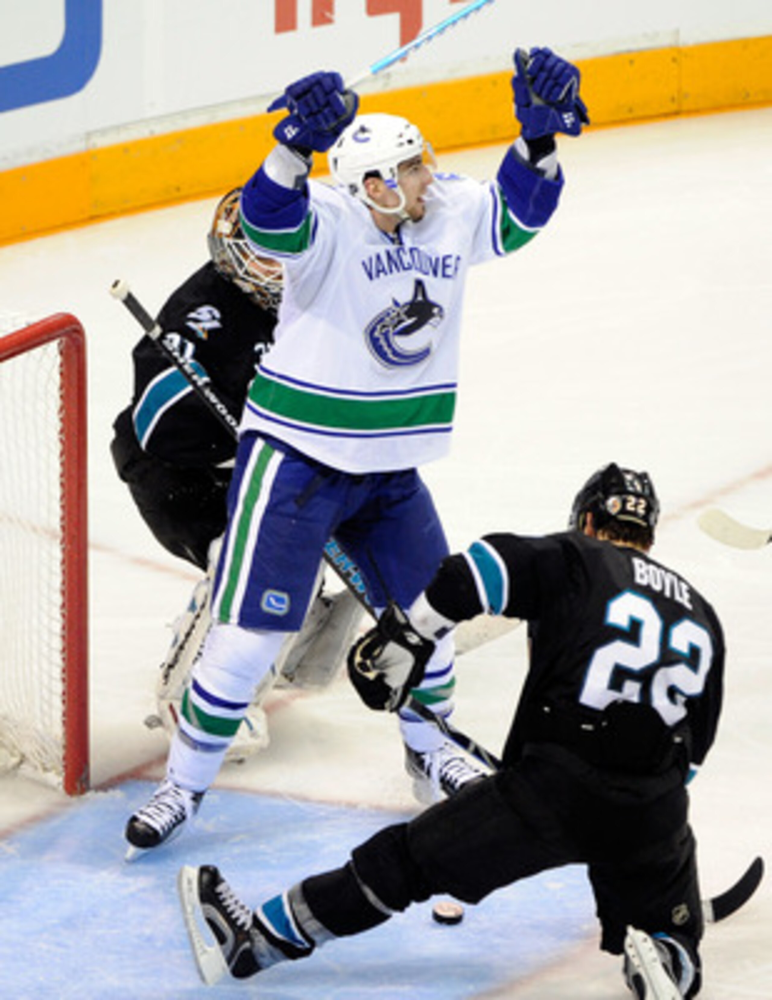 SAN JOSE, CA - MAY 22:  Alex Burrows #14 of the Vancouver Canucks celebrates after scoring from the left wing on a pass through the crease past goaltender Antti Niemi #31 of the San Jose Sharks in the third period in Game Four of the Western Conference Fi