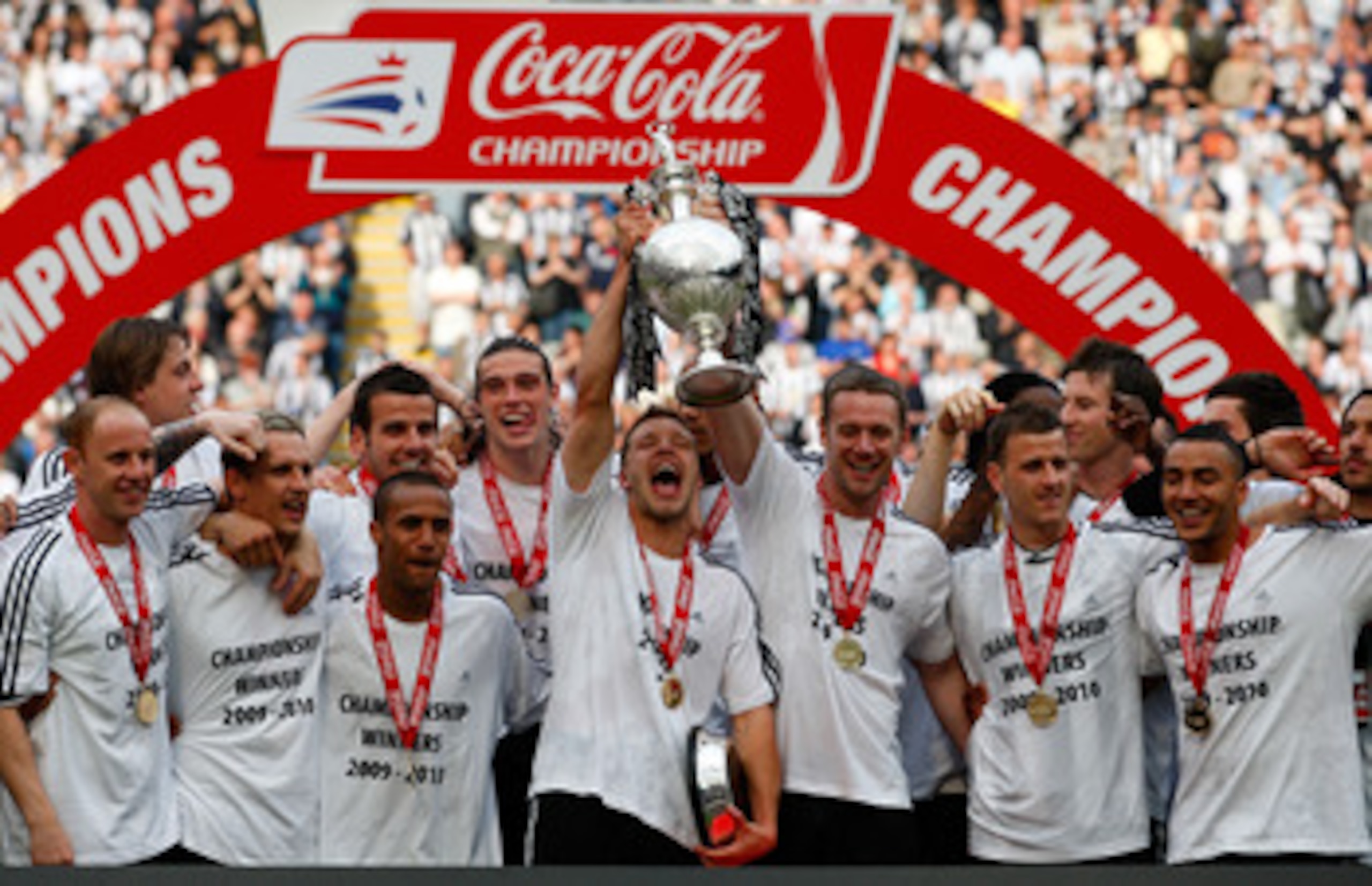 NEWCASTLE UPON TYNE, ENGLAND - APRIL 24:  Newcastle captains Alan Smith and Kevin Nolan lift the trophy as Newcastle are crowned champions of the Championship after the Coca Cola Championship match between Newcastle United and  Ipswich Town at St. James P