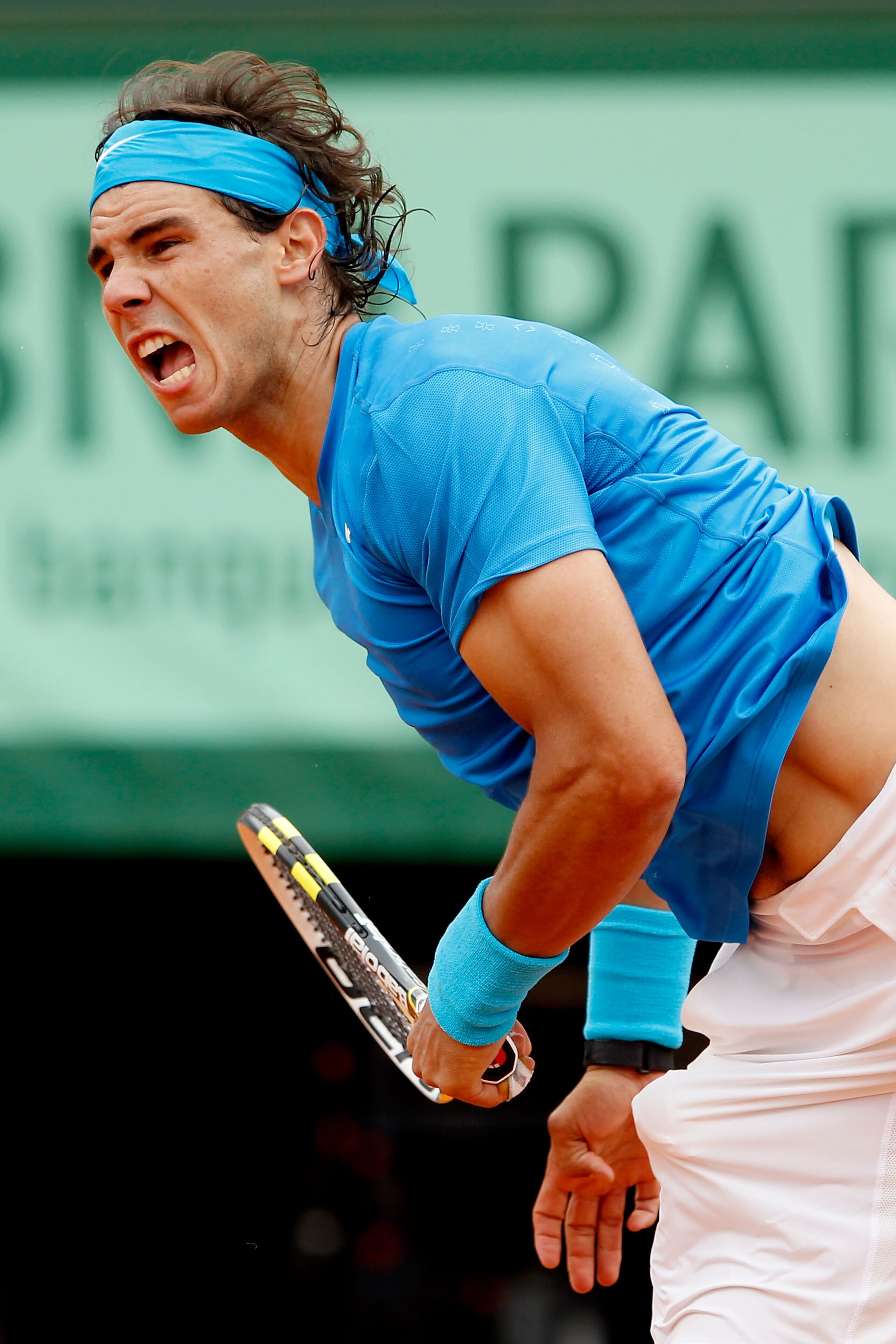 PARIS, FRANCE - MAY 30:  Rafael Nadal of Spain serves during the men's singles round four match between Rafael Nadal of Spain and Ivan Lubicic of Croatia on day nine of the French Open at Roland Garros on May 30, 2011 in Paris, France.  (Photo by Matthew