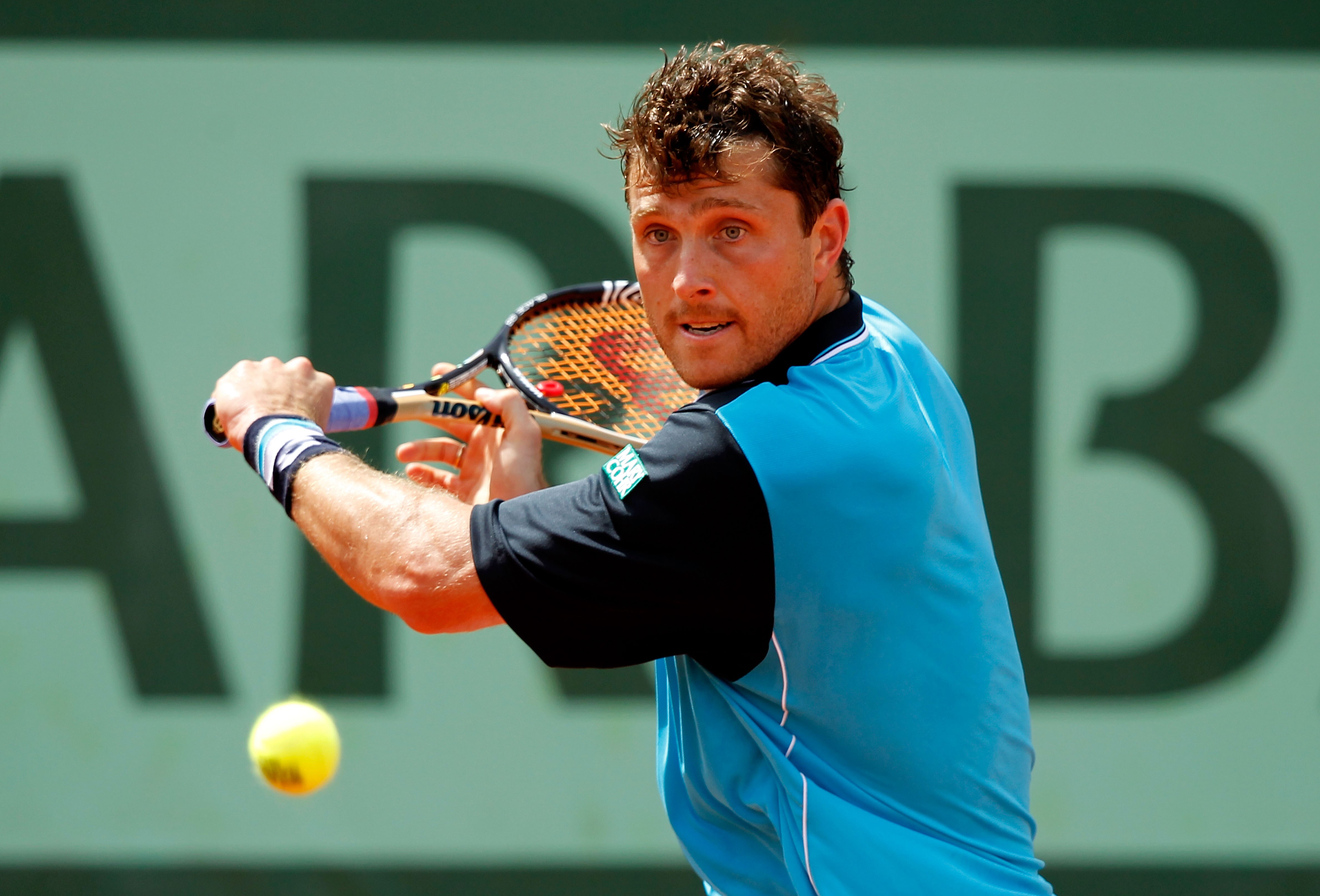PARIS, FRANCE - MAY 28:  Michael Berrer of Germany hits a backhand during the men's singles round three match between Andy Murray of Great Britain and Michael Berrer of Germany on day seven of the French Open at Roland Garros on May 28, 2011 in Paris, Fra