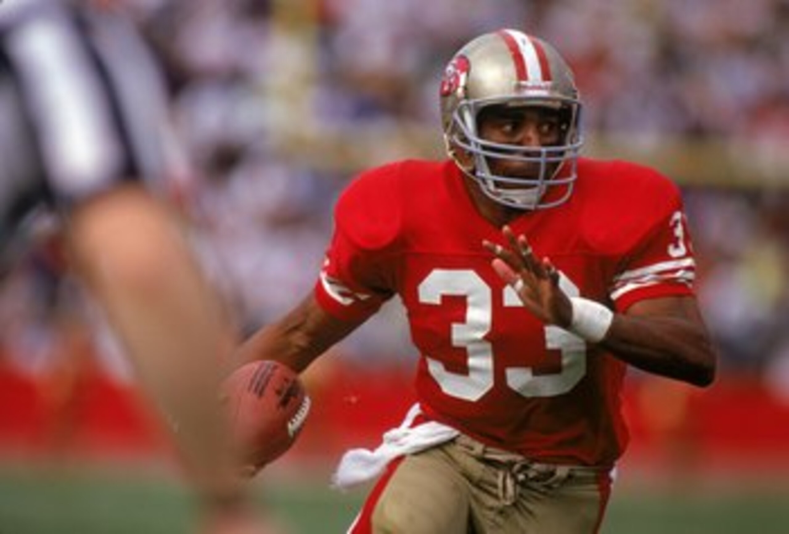 SAN FRANCISCO - OCTOBER 22: Running back Roger Craig #33 of the San Francisco 49ers looks for room to run against the New England Patriots defense during a game at Candlestick Park on October 22, 1989 in San Francisco, California. The 49ers won 37-20. SAN FRANCISCO - OCTOBER 22: Running back Roger Craig #33 of the San Francisco 49ers looks for room to run against the New England Patriots defense during a game at Candlestick Park on October 22, 1989 in San Francisco, California. The 49ers won 37-20.