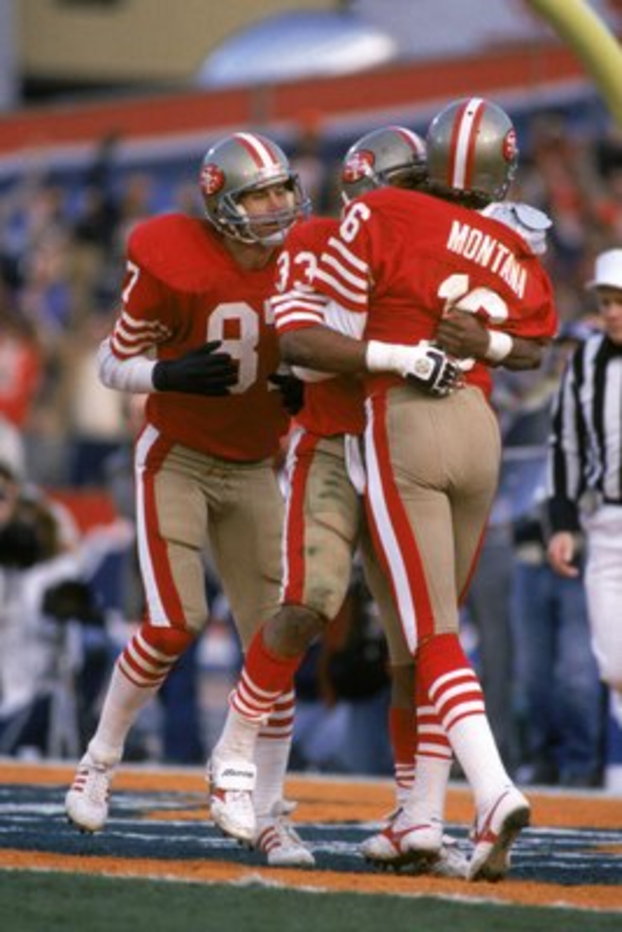 STANFORD, CA - JANUARY 20: Quarterback Joe Montana #16 of the San Francisco 49ers congratulates teammate running back Roger Craig #33 after his eight yard touchdown reception in Super Bowl XIX against the Miami Dolphins at Stanford Stadium on January 20, STANFORD, CA - JANUARY 20: Quarterback Joe Montana #16 of the San Francisco 49ers congratulates teammate running back Roger Craig #33 after his eight yard touchdown reception in Super Bowl XIX against the Miami Dolphins at Stanford Stadium on January 20,