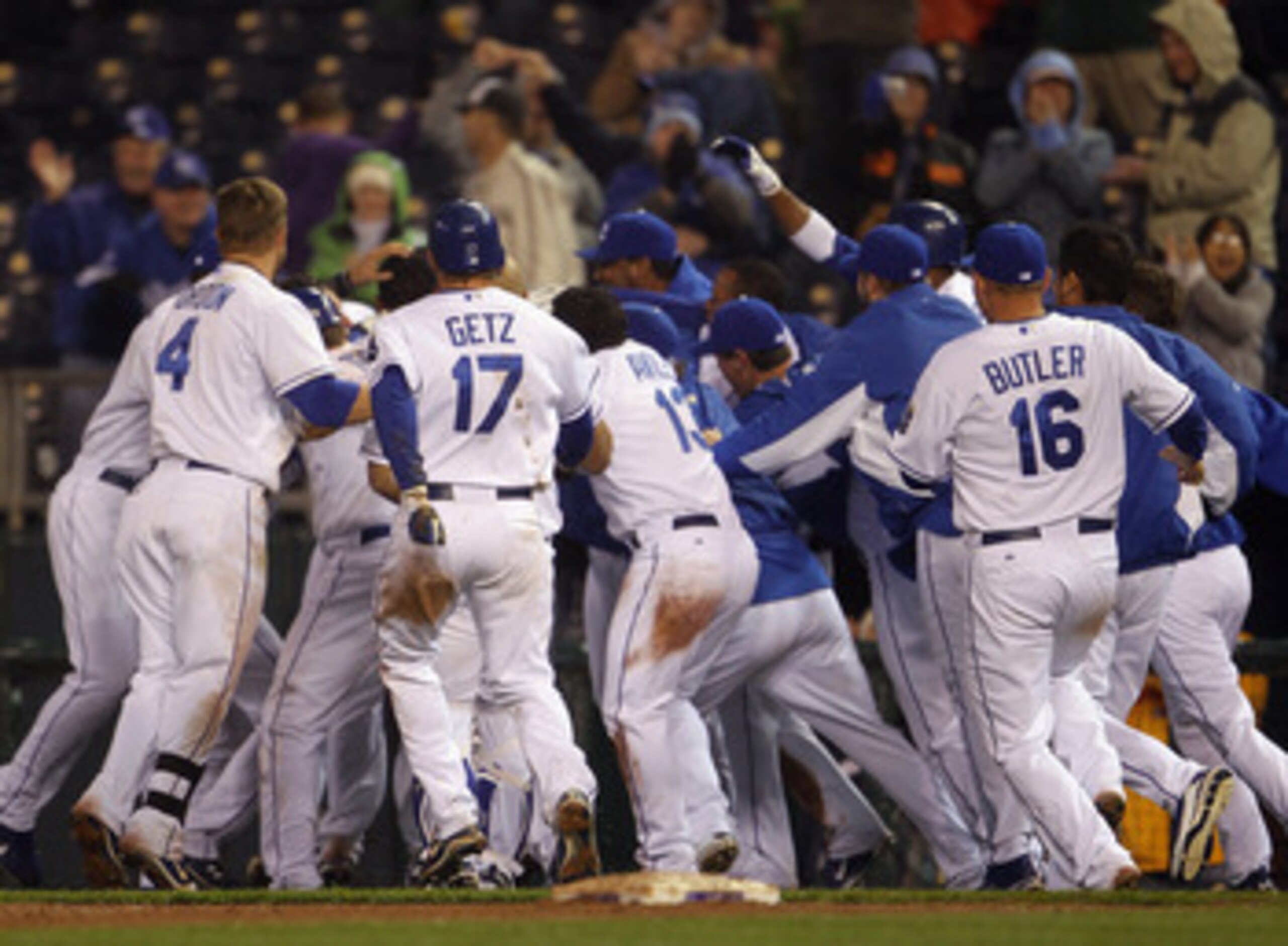 KANSAS CITY, MO - APRIL 21: Melky Cabrera #53 of the Kansas City Royals is swarmed by teammates after knocking in the game-winning run to defeat the Cleveland Indians as the Royals win the game 3-2 on April 21, 2011 at Kauffman Stadium in Kansas City, Mi KANSAS CITY, MO - APRIL 21: Melky Cabrera #53 of the Kansas City Royals is swarmed by teammates after knocking in the game-winning run to defeat the Cleveland Indians as the Royals win the game 3-2 on April 21, 2011 at Kauffman Stadium in Kansas City, Mi