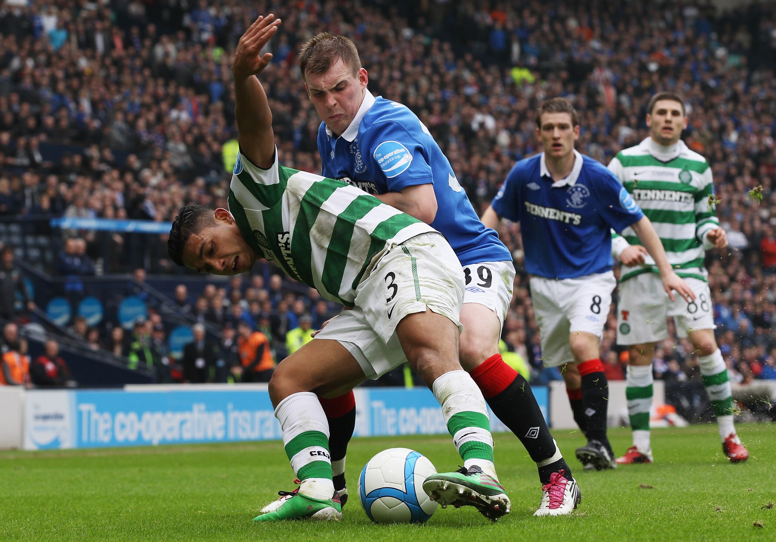 GLASGOW, SCOTLAND - MARCH 20:  Emilio Izaguirre of Celtic tackles Gregg Wylde Rangers during the Co-operative Insurance Cup Final between Celtic and Rangers at Hampden Park on March 20, 2011 in Glasgow, Scotland.  (Photo by Jeff J Mitchell/Getty Images)