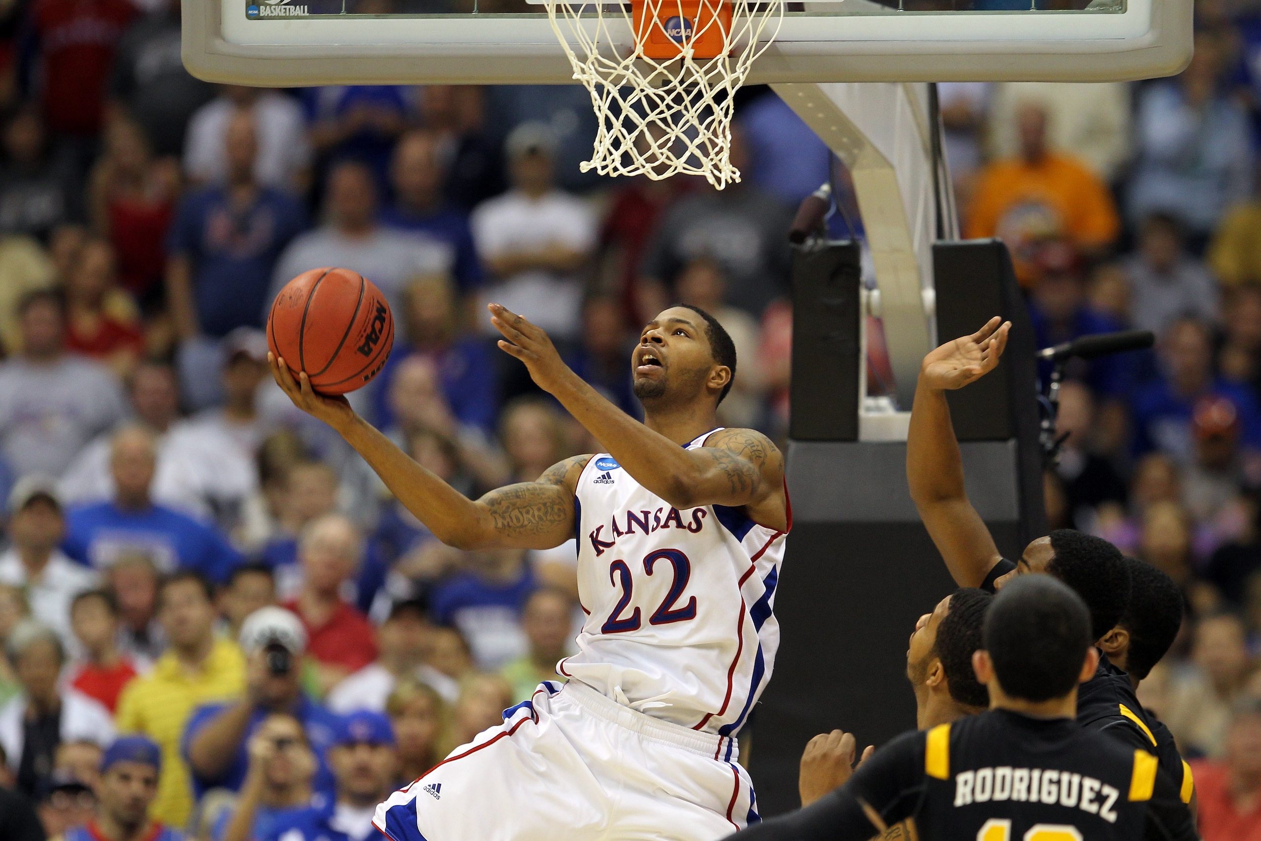 SAN ANTONIO, TX - MARCH 27:  Marcus Morris #22 of the Kansas Jayhawks goes to the basket against the Virginia Commonwealth Rams during the southwest regional final of the 2011 NCAA men's basketball tournament at the Alamodome on March 27, 2011 in San Anto