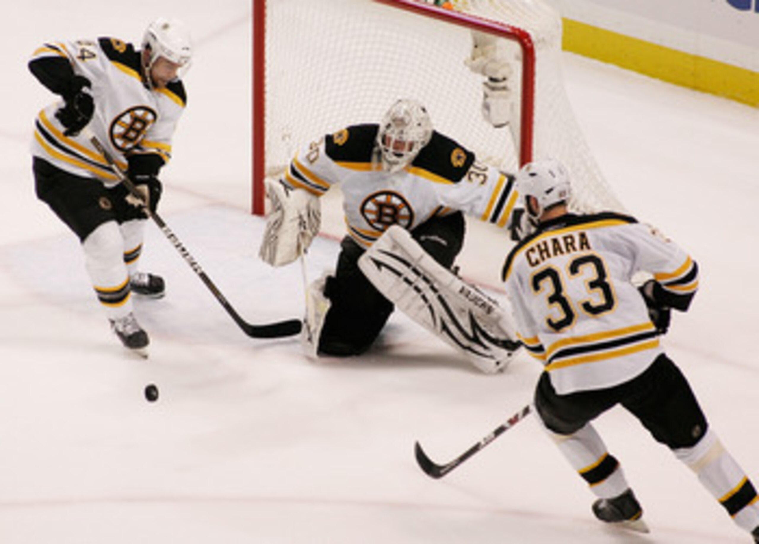TAMPA, FL - MAY 19:  Dennis Seidenberg #44, Tim Thomas #30 and Zdeno Chara #33 of the Boston Bruins defend their goal in Game Three of the Eastern Conference Finals against the Tampa Bay Lightning during the 2011 NHL Stanley Cup Playoffs at St Pete Times 