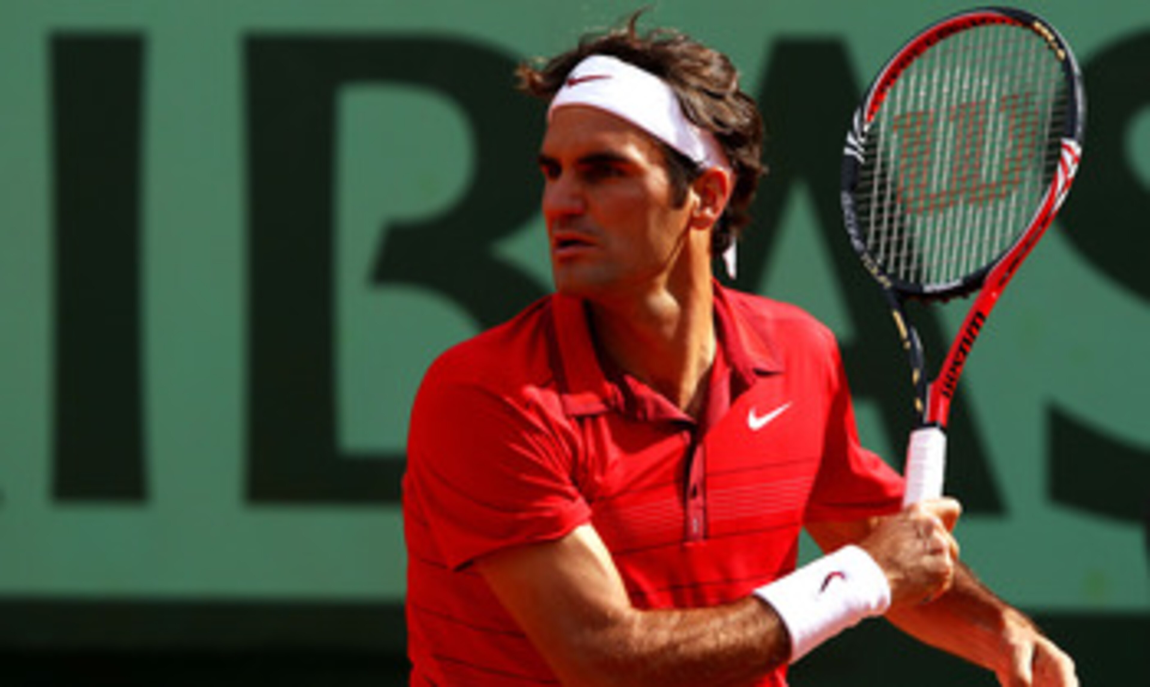 PARIS, FRANCE - MAY 31:  Roger Federer of Switzerland hits a forehand during the men's singles quarterfinal match between Gael Monfils of France and Roger Federer of Switzerland on day ten of the French Open at Roland Garros on May 31, 2011 in Paris, Fran